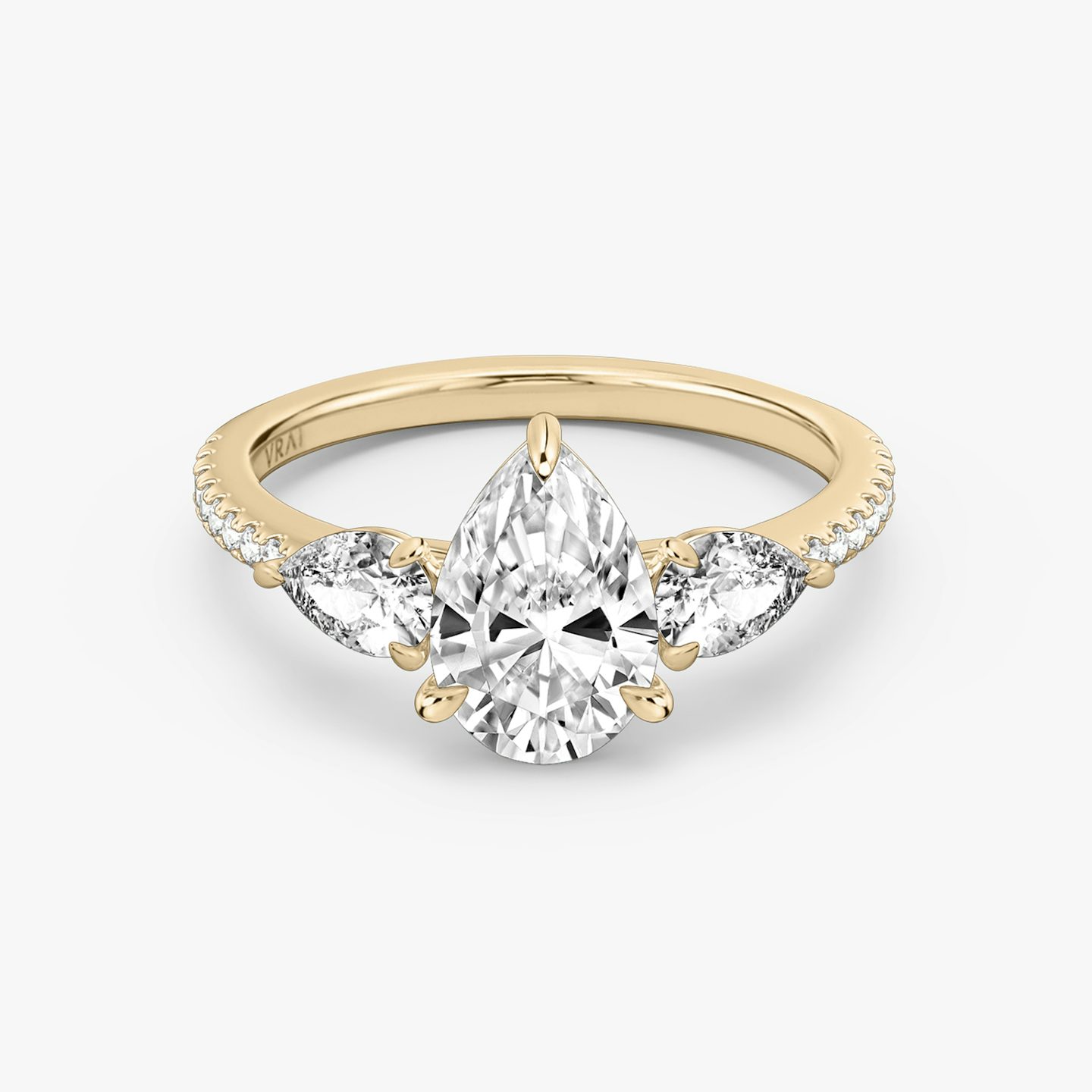 The Three Stone | Pear | 14k | Rose Gold | bandAccent: Pavé | sideStoneCarat: 0.25ct | sideStoneShape: Pear | diamondOrientation: vertical | caratWeight: other