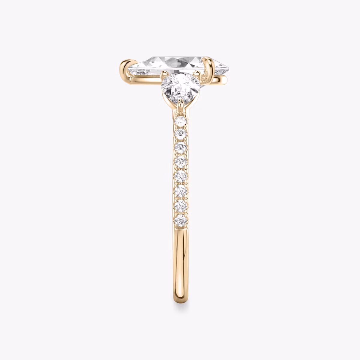 The Three Stone | Pear | 14k | Rose Gold | bandAccent: Pavé | sideStoneCarat: 0.25ct | sideStoneShape: Pear | diamondOrientation: vertical | caratWeight: other