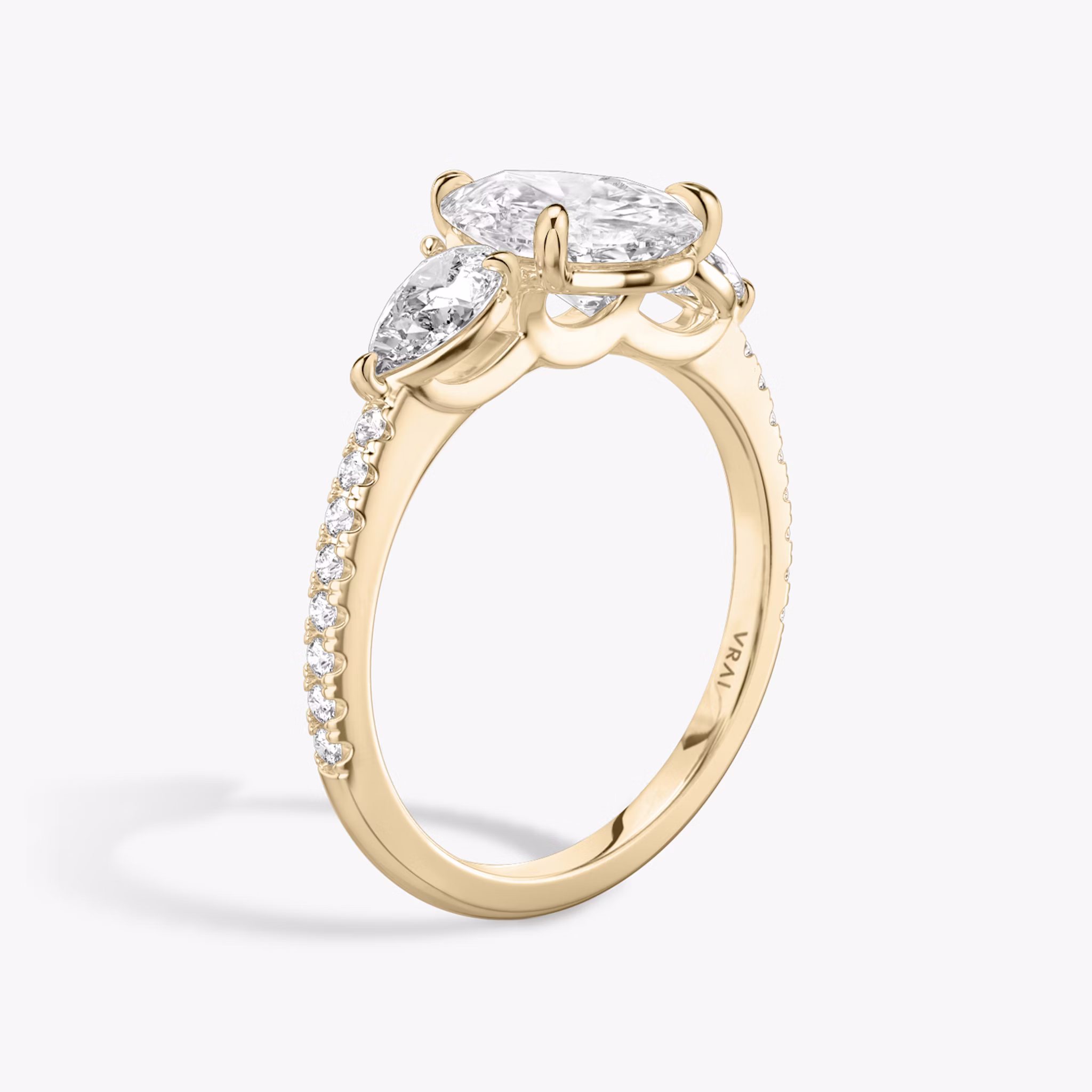 The Three Stone | Pear | 14k | Rose Gold | bandAccent: Pavé | sideStoneCarat: 0.25ct | sideStoneShape: Pear | diamondOrientation: vertical | caratWeight: other