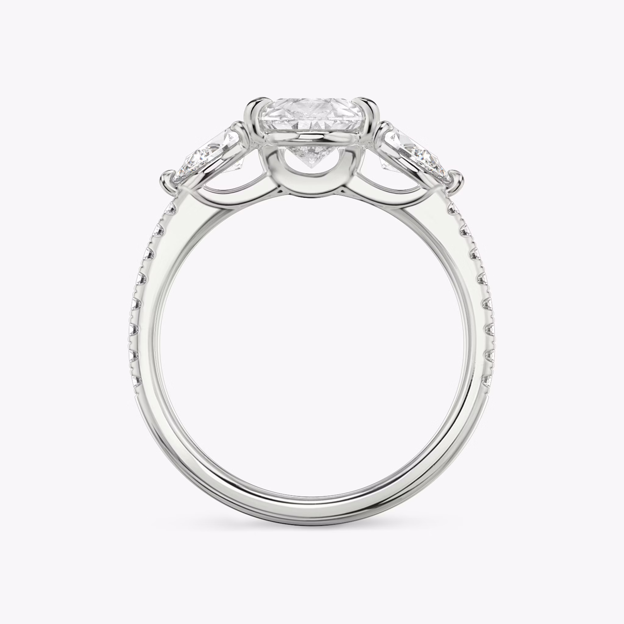 The Three Stone | Pear | Platinum | bandAccent: Pavé | sideStoneCarat: 0.25ct | sideStoneShape: Pear | diamondOrientation: vertical | caratWeight: other