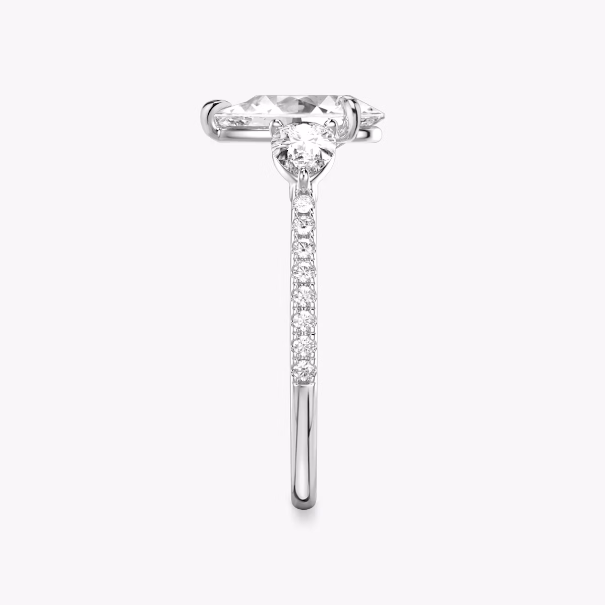 The Three Stone | Pear | 18k | White Gold | bandAccent: Pavé | sideStoneCarat: 0.25ct | sideStoneShape: Pear | diamondOrientation: vertical | caratWeight: other