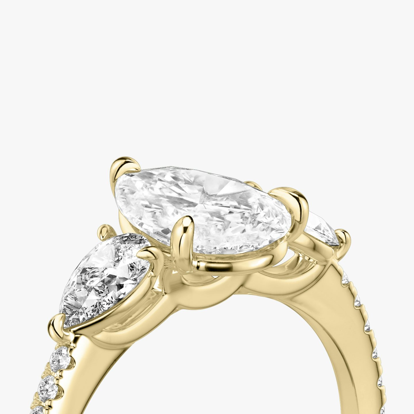 The Three Stone | Pear | 18k | Yellow Gold | bandAccent: Pavé | sideStoneCarat: 0.25ct | sideStoneShape: Pear | diamondOrientation: vertical | caratWeight: other