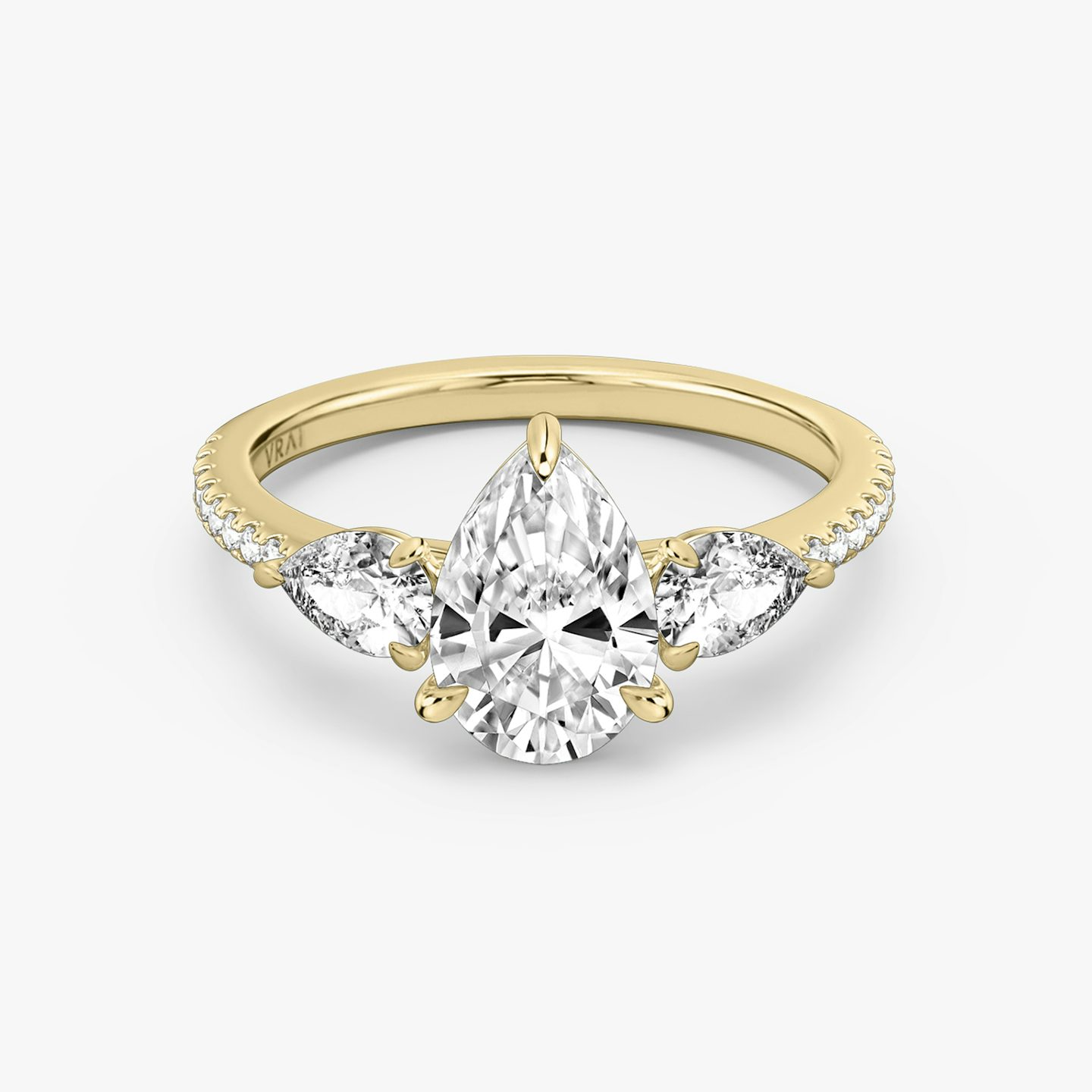 The Three Stone | Pear | 18k | Yellow Gold | bandAccent: Pavé | sideStoneCarat: 0.25ct | sideStoneShape: Pear | diamondOrientation: vertical | caratWeight: other