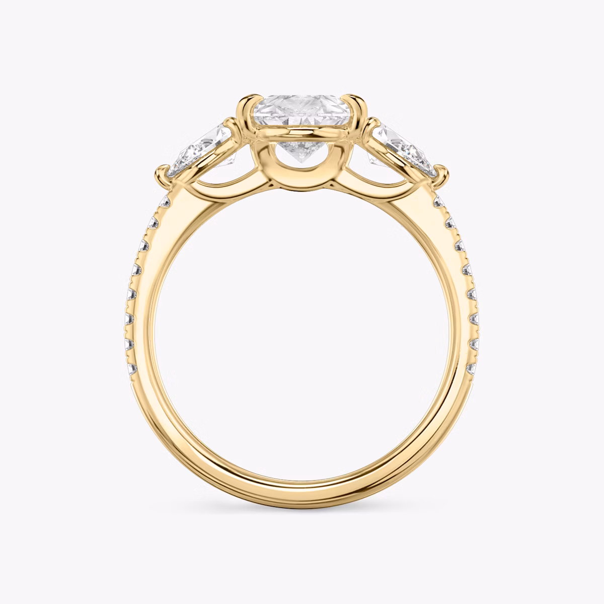 The Three Stone | Pear | 18k | Yellow Gold | bandAccent: Pavé | sideStoneCarat: 0.25ct | sideStoneShape: Pear | diamondOrientation: vertical | caratWeight: other