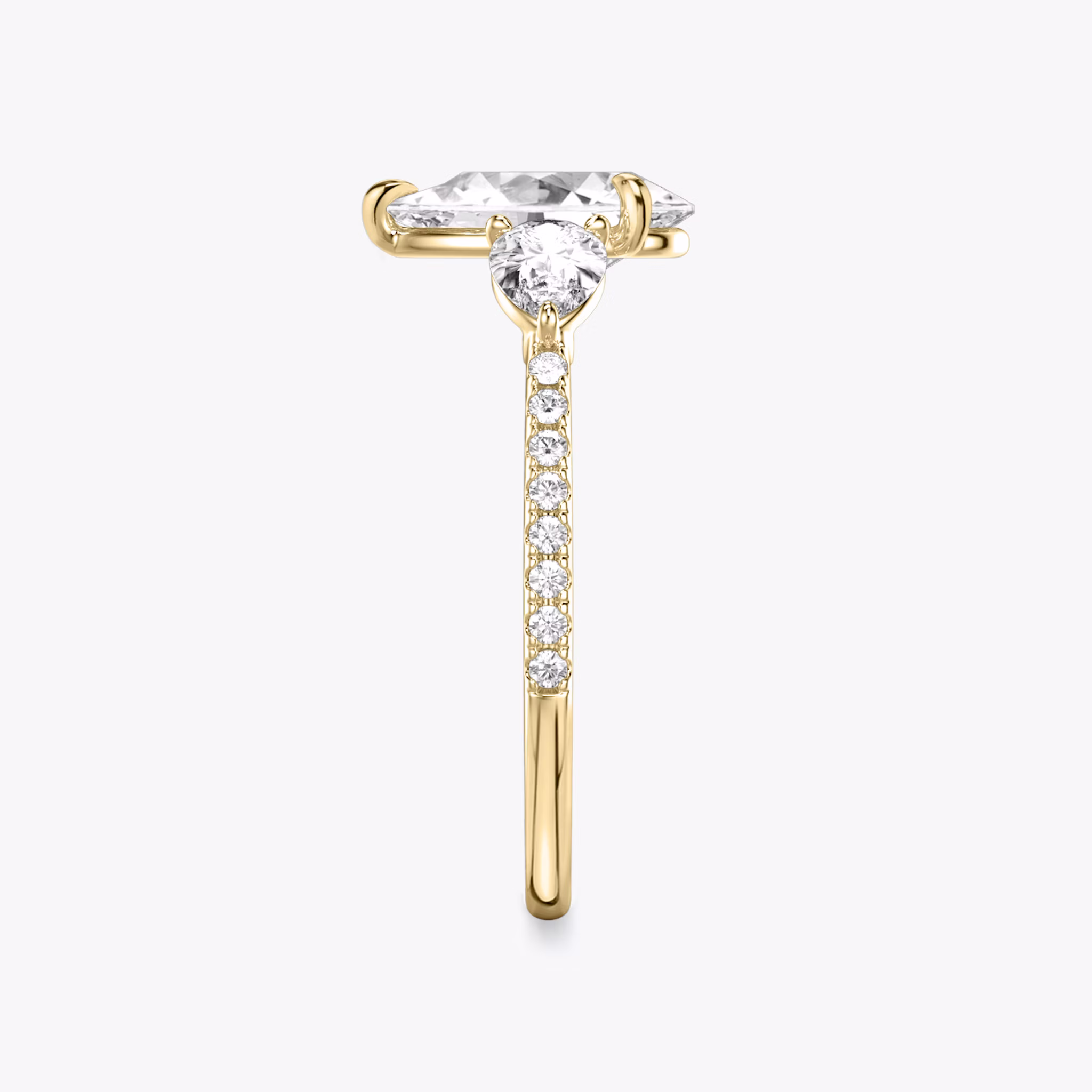 The Three Stone | Pear | 18k | Yellow Gold | bandAccent: Pavé | sideStoneCarat: 0.25ct | sideStoneShape: Pear | diamondOrientation: vertical | caratWeight: other