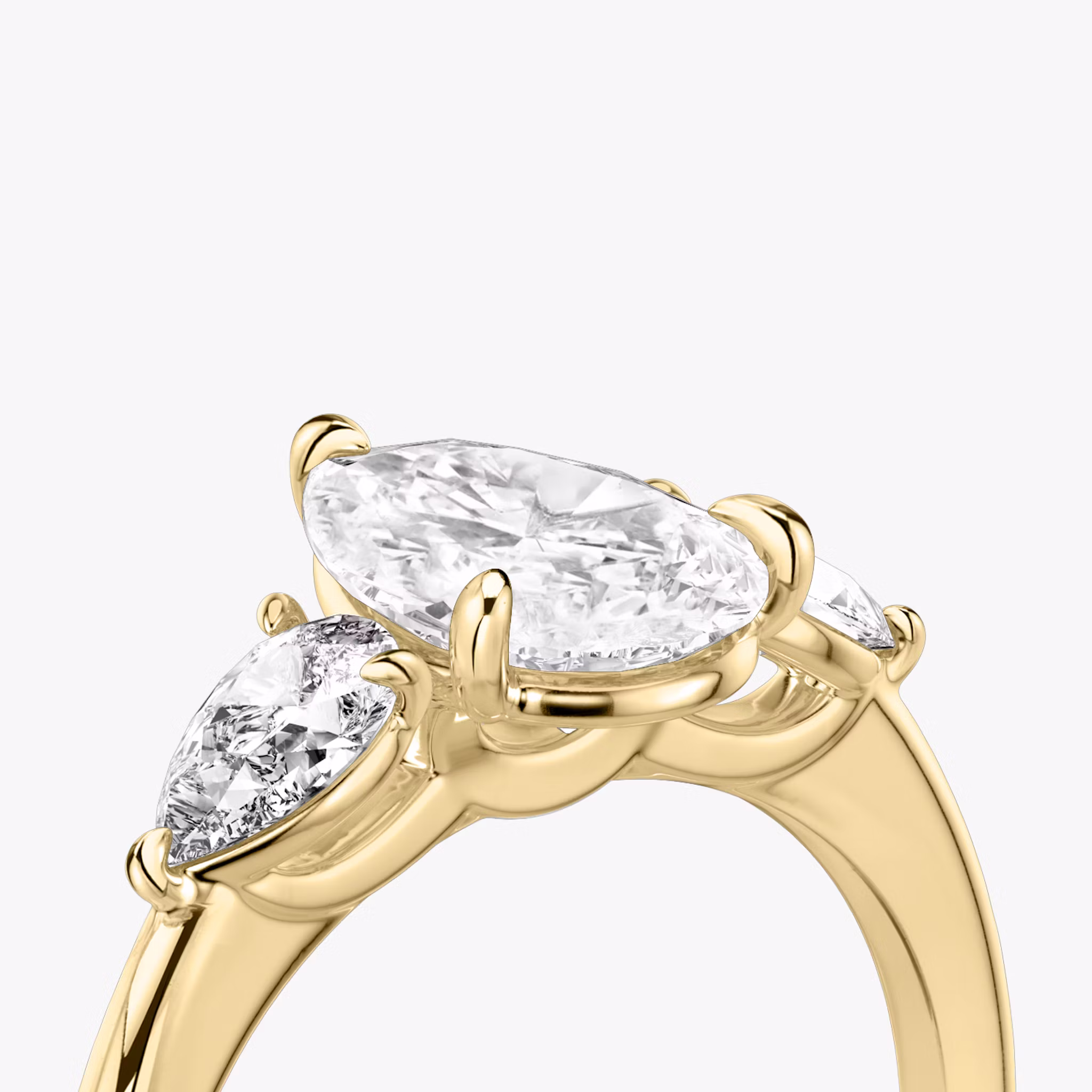 The Three Stone | Pear | 18k | Yellow Gold | bandAccent: Plain | sideStoneCarat: 0.25ct | sideStoneShape: Pear | diamondOrientation: vertical | caratWeight: other