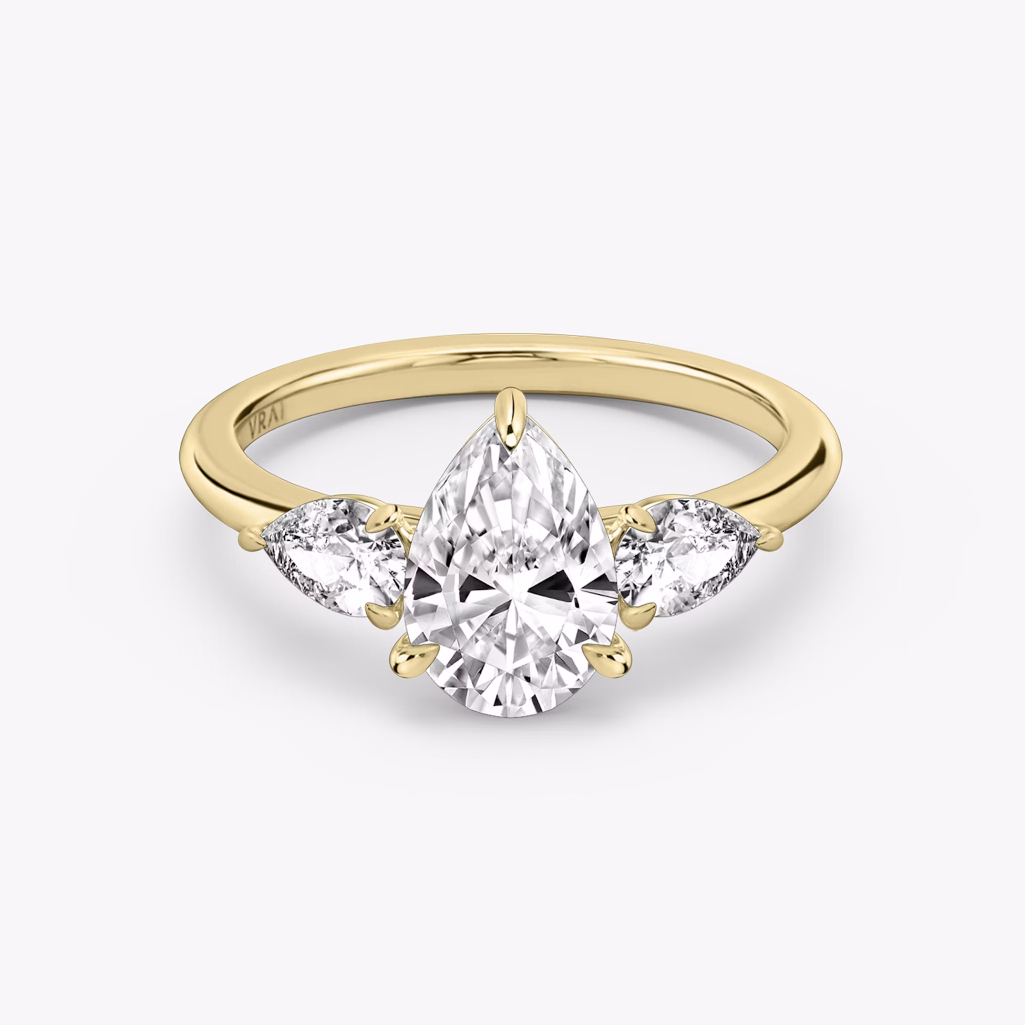 The Three Stone | Pear | 18k | Yellow Gold | bandAccent: Plain | sideStoneCarat: 0.25ct | sideStoneShape: Pear | diamondOrientation: vertical | caratWeight: other