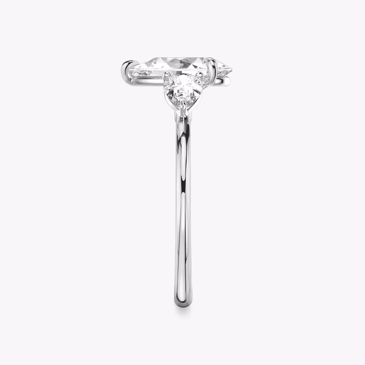 The Three Stone | Pear | Platinum | bandAccent: Plain | sideStoneCarat: 0.25ct | sideStoneShape: Pear | diamondOrientation: vertical | caratWeight: other