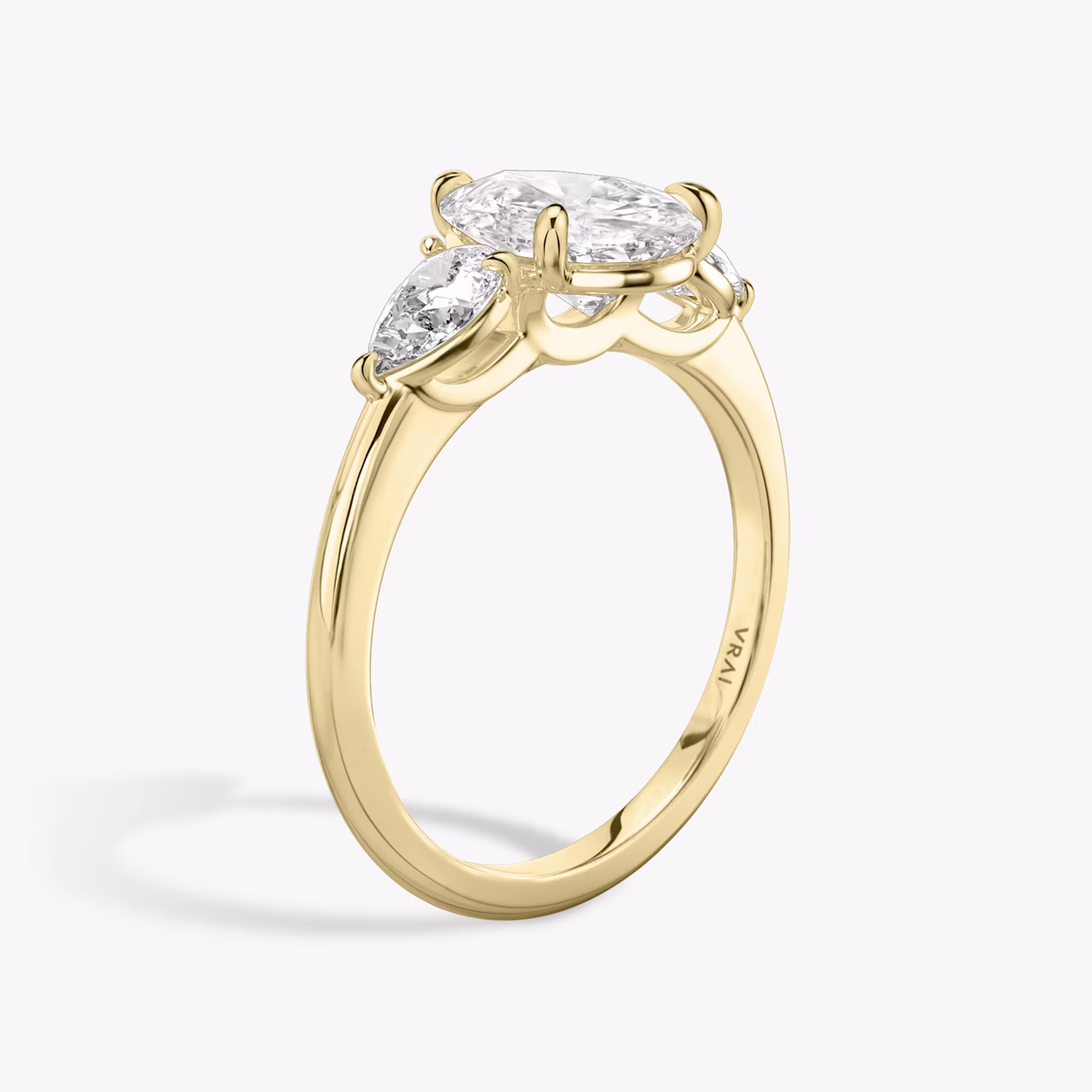The Three Stone | Pear | 18k | Yellow Gold | bandAccent: Plain | sideStoneCarat: 0.25ct | sideStoneShape: Pear | diamondOrientation: vertical | caratWeight: other