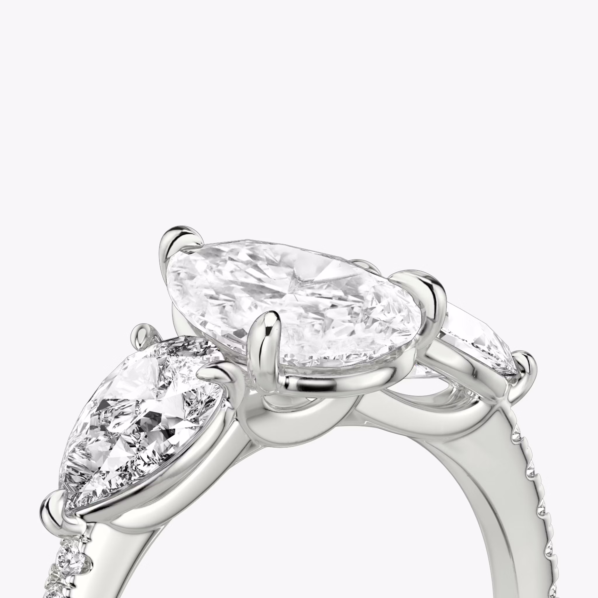 The Three Stone | Pear | 18k | White Gold | bandAccent: Pavé | sideStoneCarat: 0.50ct | sideStoneShape: Pear | diamondOrientation: vertical | caratWeight: other