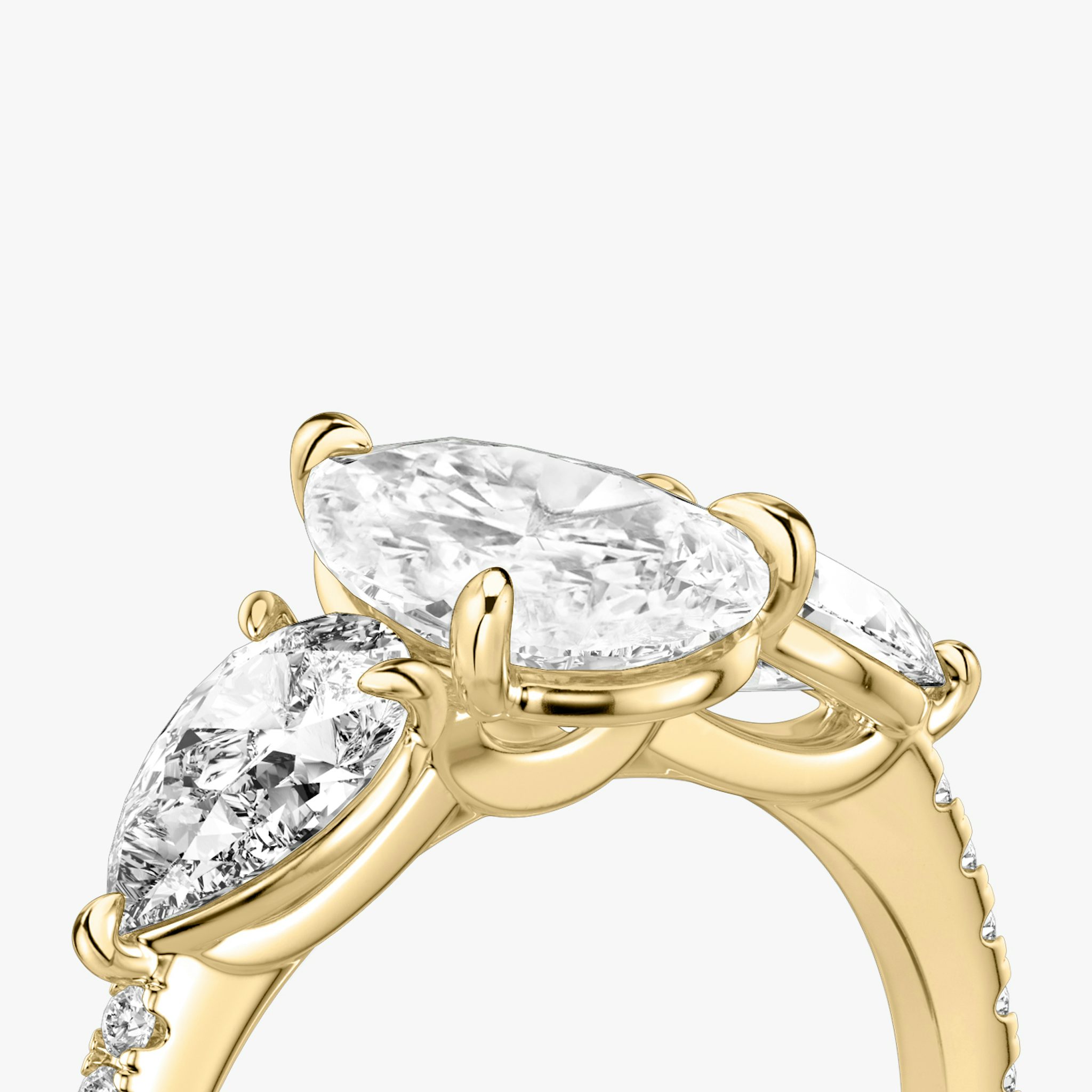 The Three Stone | Pear | 18k | Yellow Gold | bandAccent: Pavé | sideStoneCarat: 0.50ct | sideStoneShape: Pear | diamondOrientation: vertical | caratWeight: other