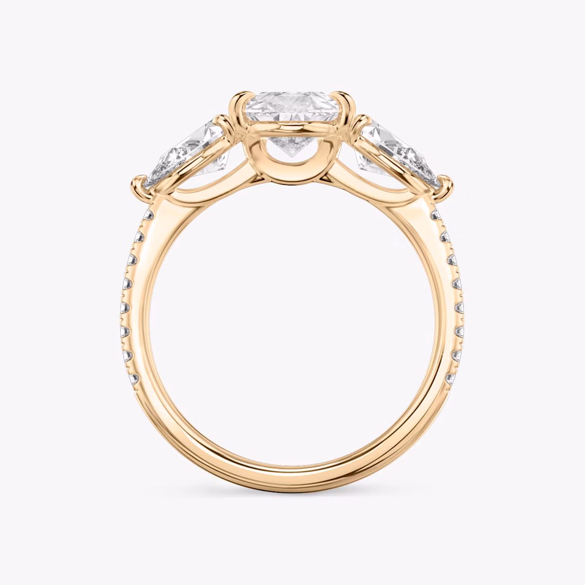 The Three Stone | Pear | 14k | Rose Gold | bandAccent: Pavé | sideStoneCarat: 0.50ct | sideStoneShape: Pear | diamondOrientation: vertical | caratWeight: other