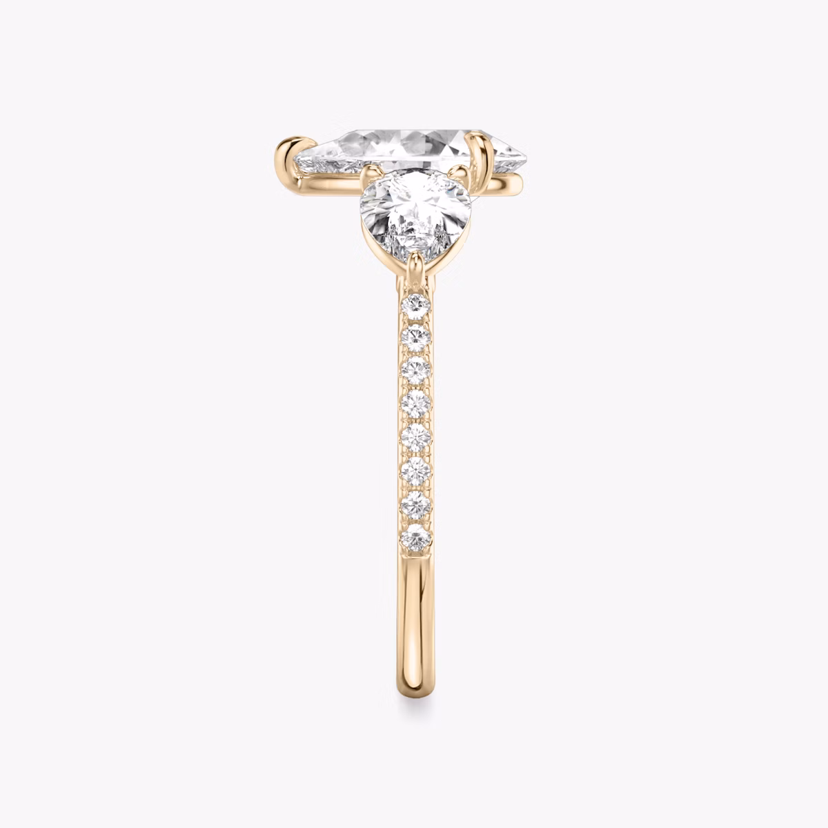 The Three Stone | Pear | 14k | Rose Gold | bandAccent: Pavé | sideStoneCarat: 0.50ct | sideStoneShape: Pear | diamondOrientation: vertical | caratWeight: other