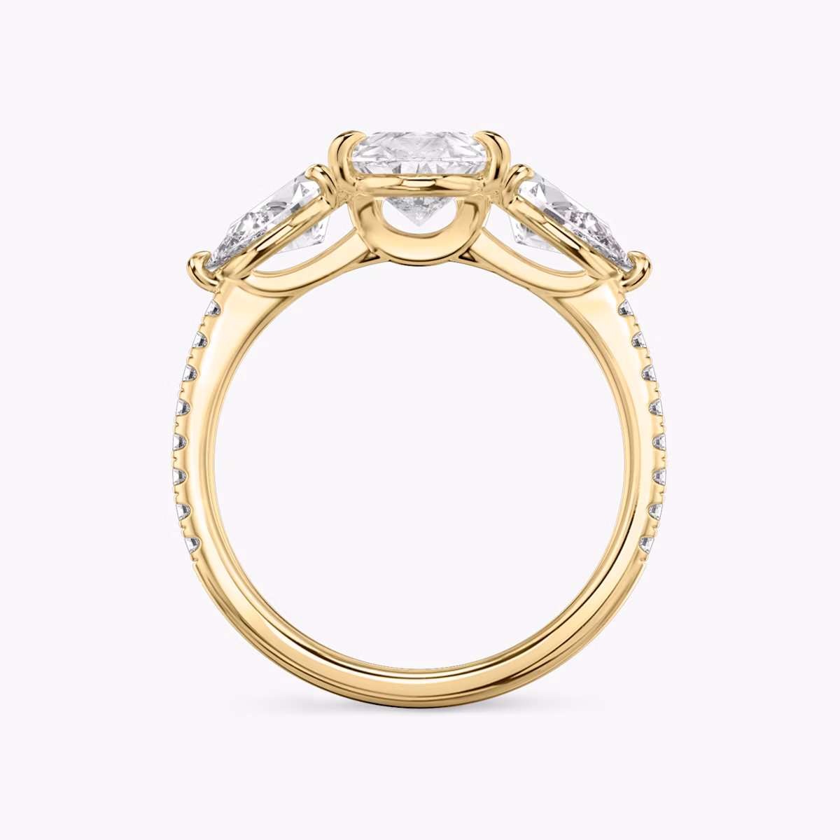 The Three Stone | Pear | 18k | Yellow Gold | bandAccent: Pavé | sideStoneCarat: 0.50ct | sideStoneShape: Pear | diamondOrientation: vertical | caratWeight: other