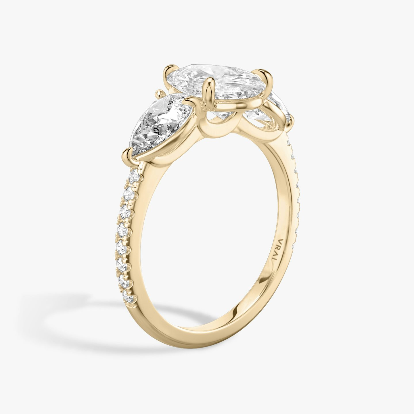 The Three Stone | Pear | 14k | Rose Gold | bandAccent: Pavé | sideStoneCarat: 0.50ct | sideStoneShape: Pear | diamondOrientation: vertical | caratWeight: other