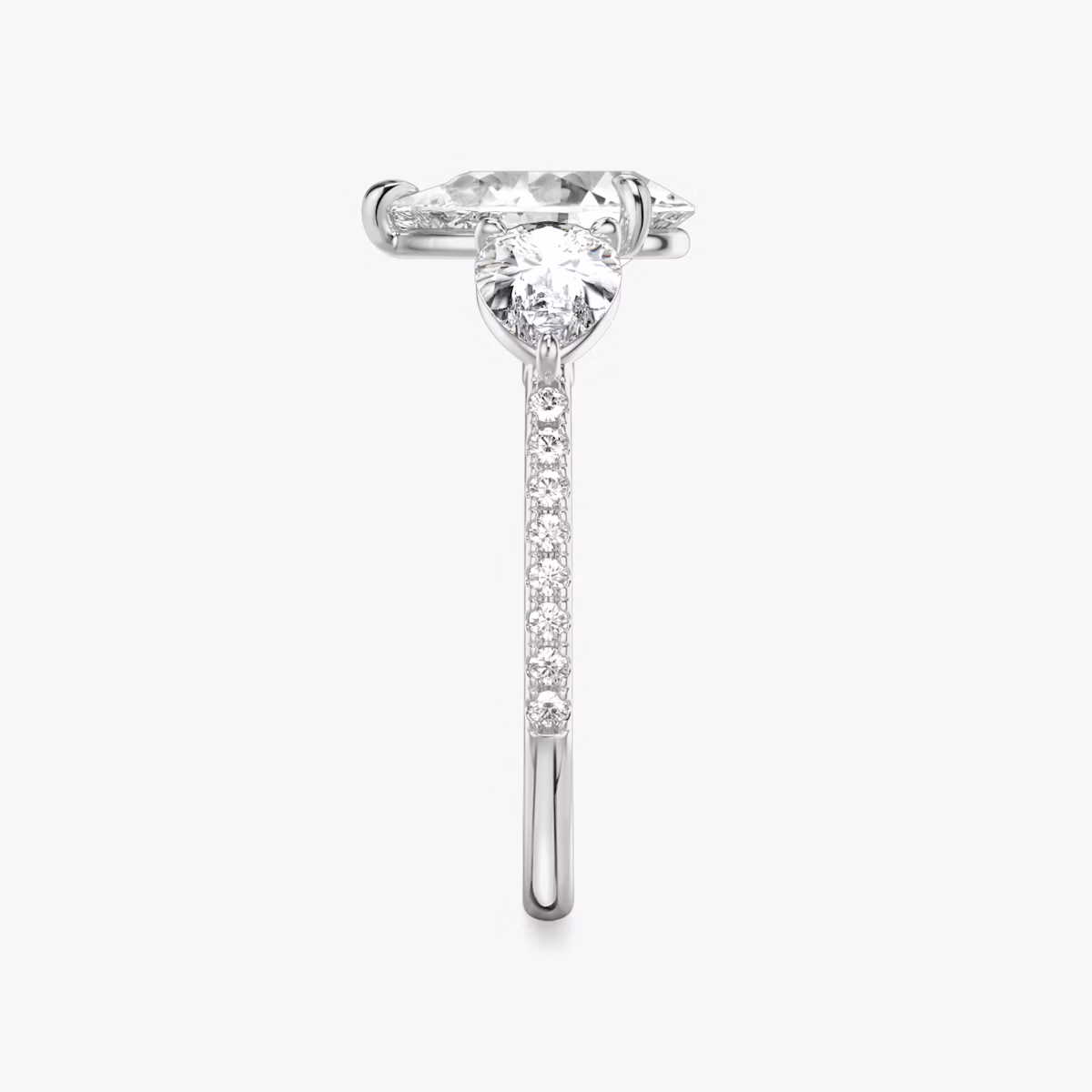 The Three Stone | Pear | Platinum | bandAccent: Pavé | sideStoneCarat: 0.50ct | sideStoneShape: Pear | diamondOrientation: vertical | caratWeight: other