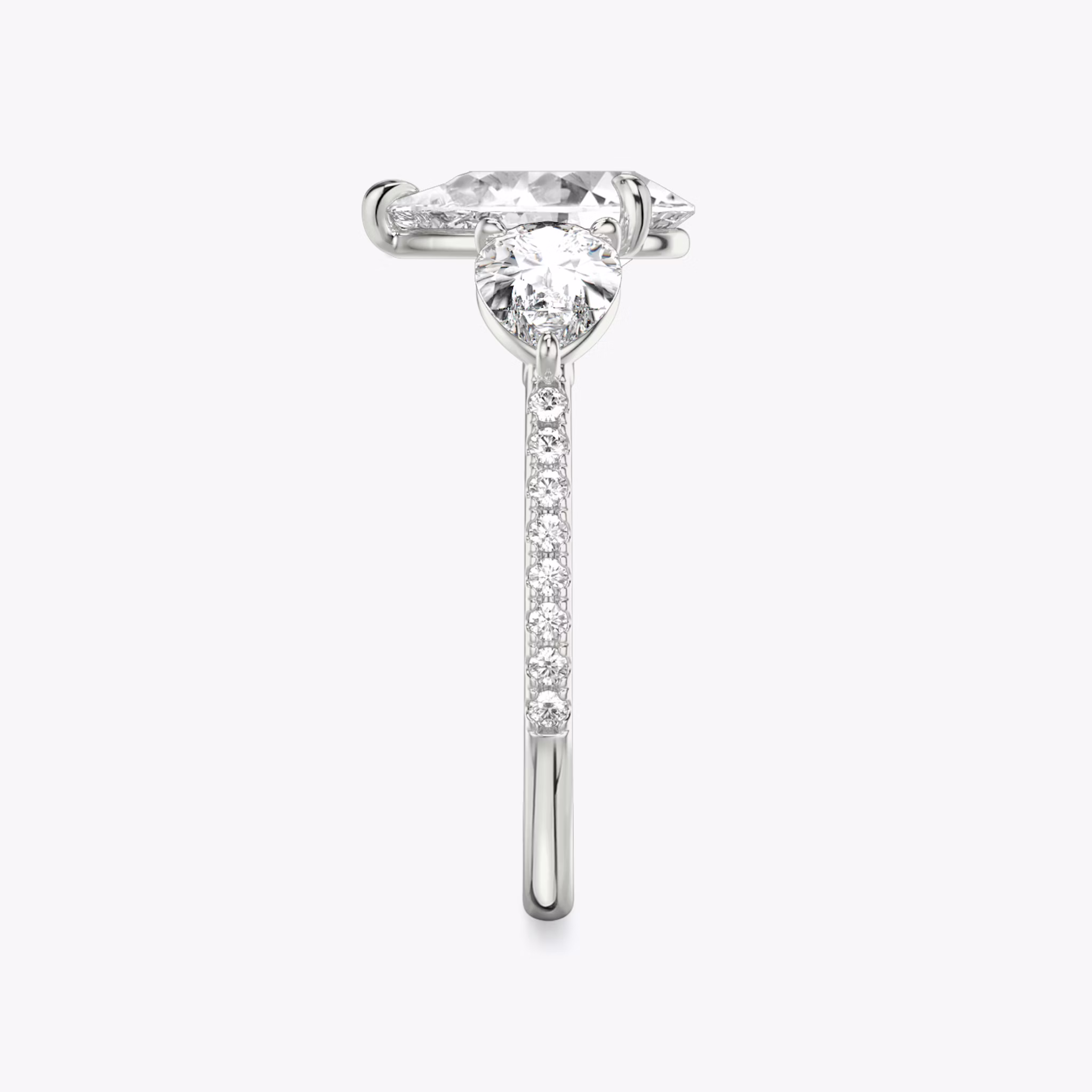 The Three Stone | Pear | 18k | White Gold | bandAccent: Pavé | sideStoneCarat: 0.50ct | sideStoneShape: Pear | diamondOrientation: vertical | caratWeight: other