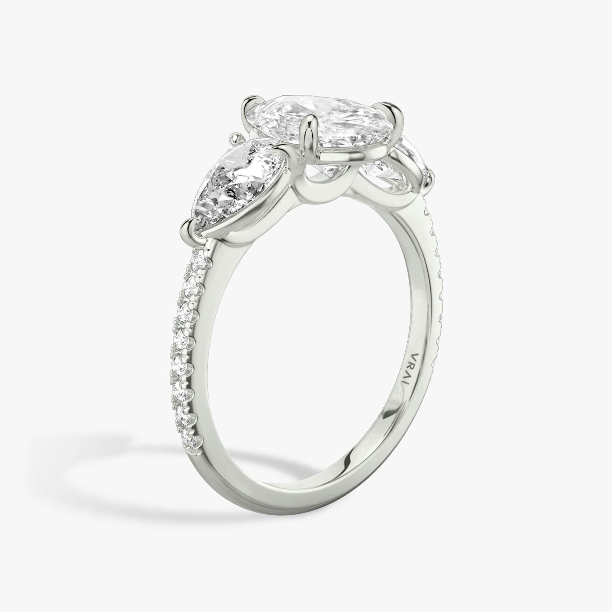 The Three Stone | Pear | 18k | White Gold | bandAccent: Pavé | sideStoneCarat: 0.50ct | sideStoneShape: Pear | diamondOrientation: vertical | caratWeight: other
