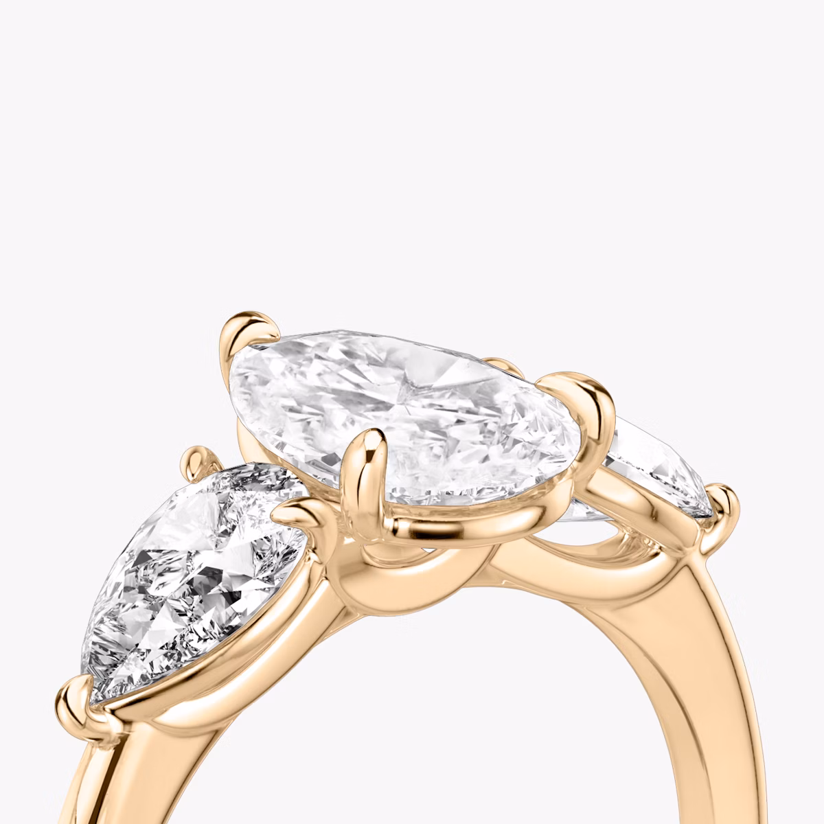 The Three Stone | Pear | 14k | Rose Gold | bandAccent: Plain | sideStoneCarat: 0.50ct | sideStoneShape: Pear | diamondOrientation: vertical | caratWeight: other