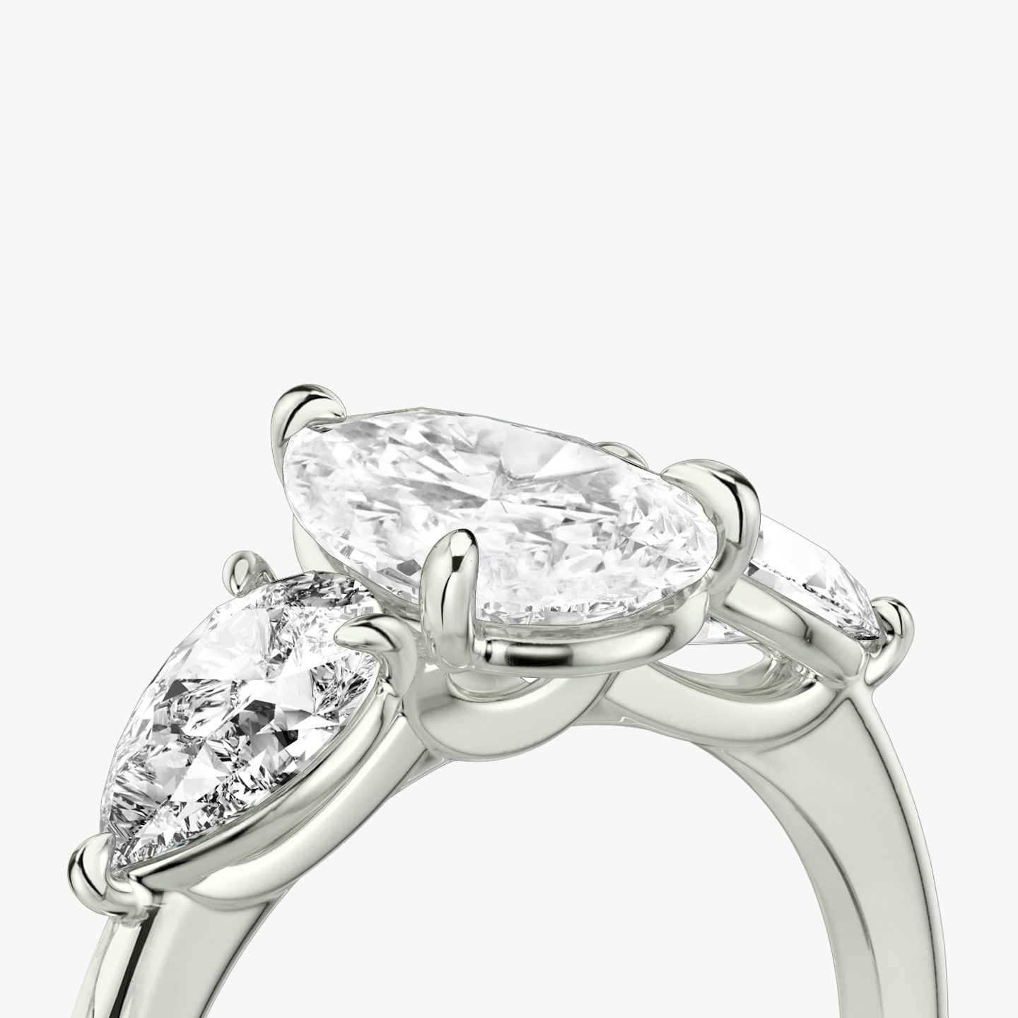 The Three Stone | Pear | Platinum | bandAccent: Plain | sideStoneCarat: 0.50ct | sideStoneShape: Pear | diamondOrientation: vertical | caratWeight: other