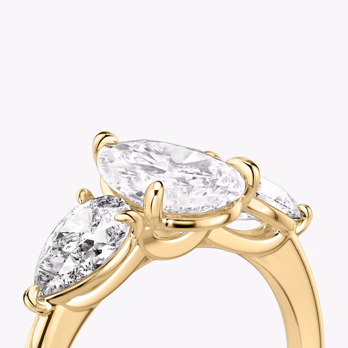 The Three Stone | Pear | 18k | Yellow Gold | bandAccent: Plain | sideStoneCarat: 0.50ct | sideStoneShape: Pear | diamondOrientation: vertical | caratWeight: other