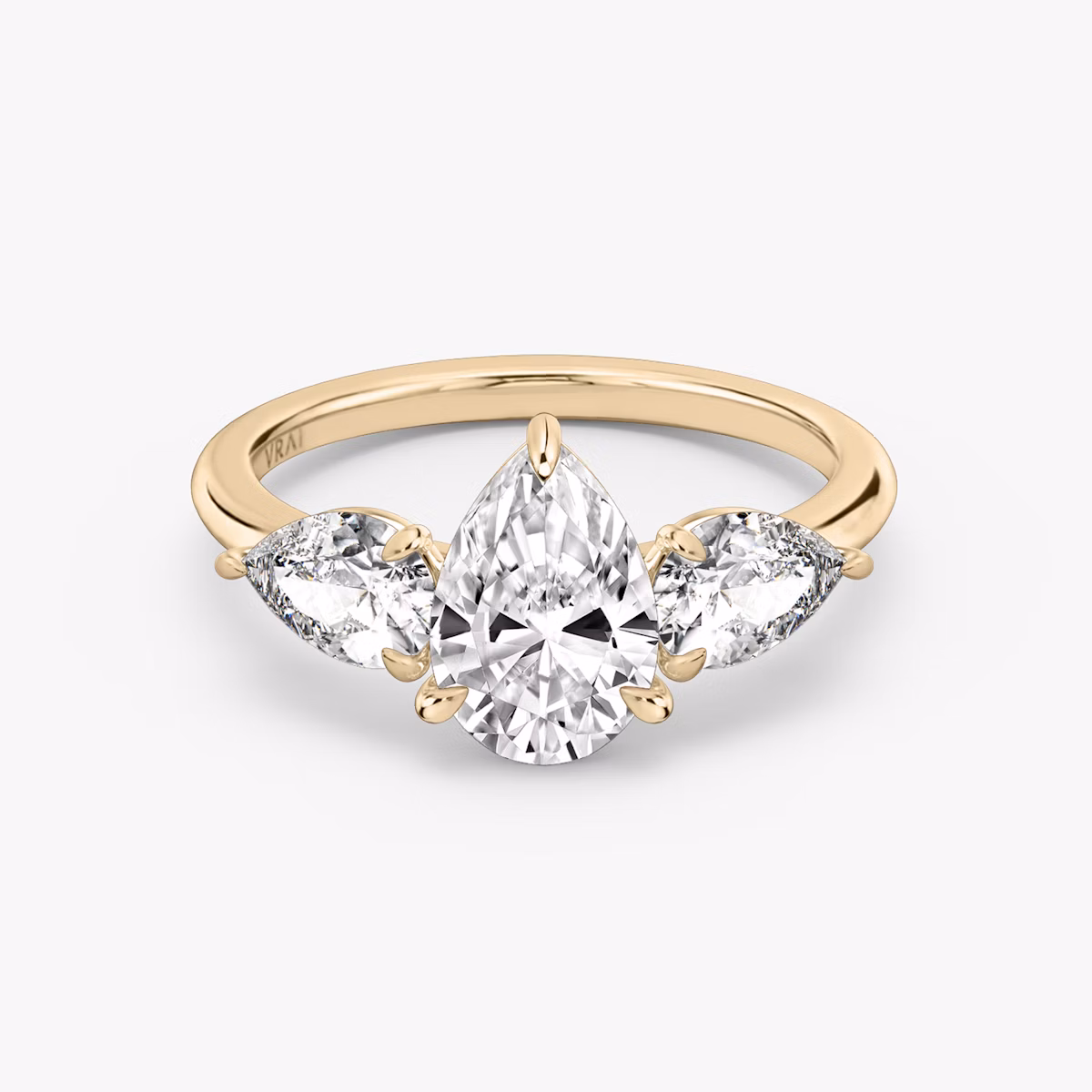 The Three Stone | Pear | 14k | Rose Gold | bandAccent: Plain | sideStoneCarat: 0.50ct | sideStoneShape: Pear | diamondOrientation: vertical | caratWeight: other