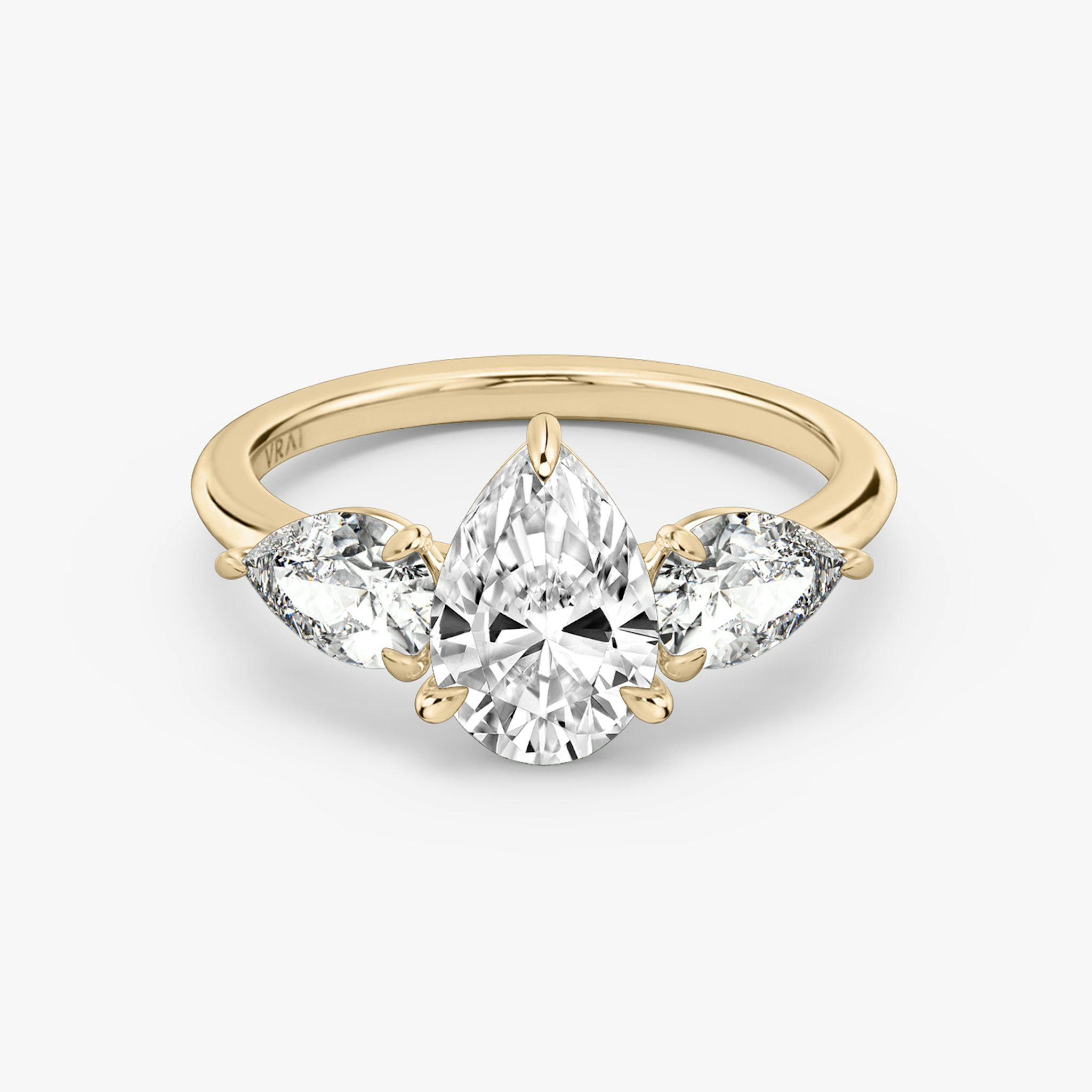 The Three Stone | Pear | 14k | Rose Gold | bandAccent: Plain | sideStoneCarat: 0.50ct | sideStoneShape: Pear | diamondOrientation: vertical | caratWeight: other