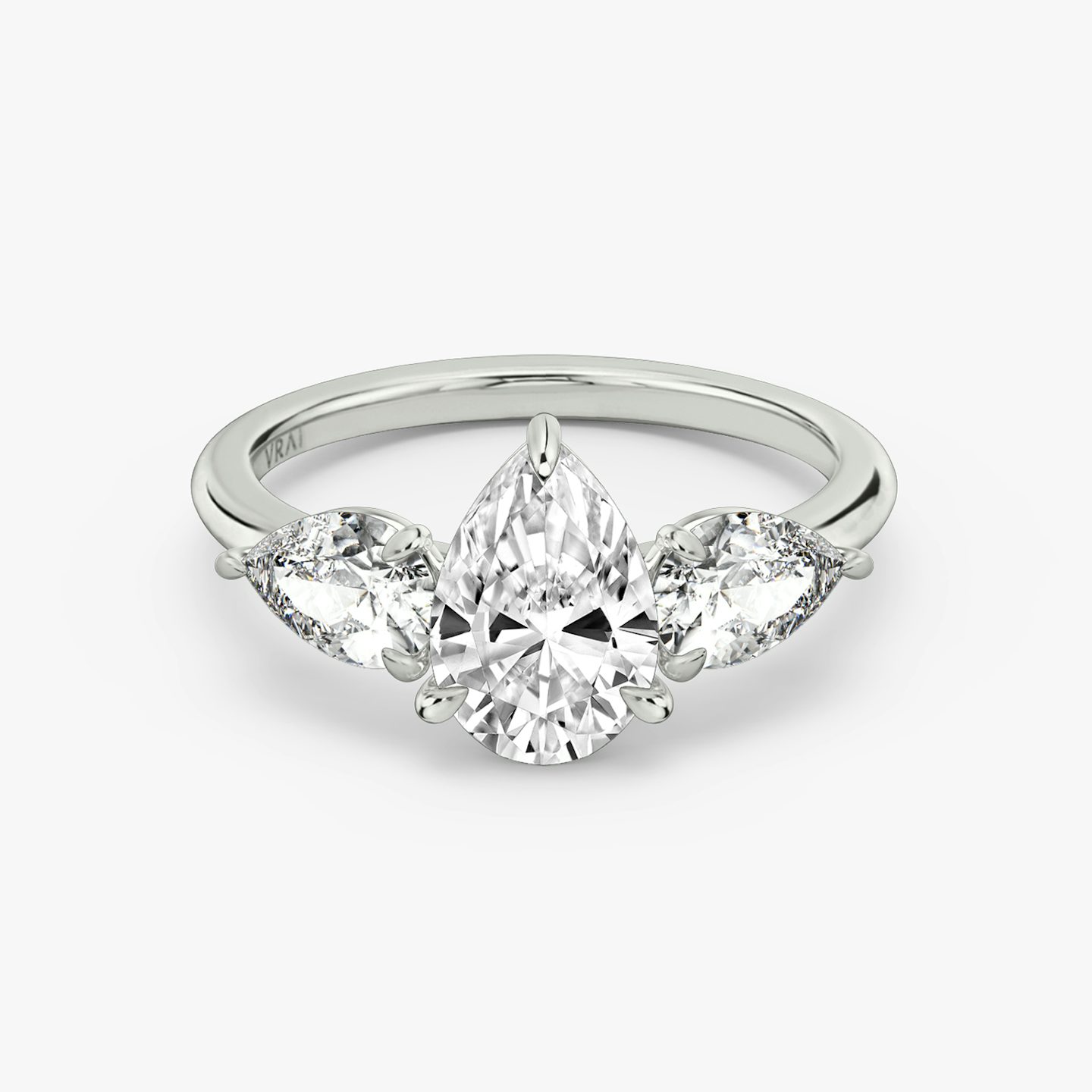 The Three Stone | Pear | Platinum | bandAccent: Plain | sideStoneCarat: 0.50ct | sideStoneShape: Pear | diamondOrientation: vertical | caratWeight: other