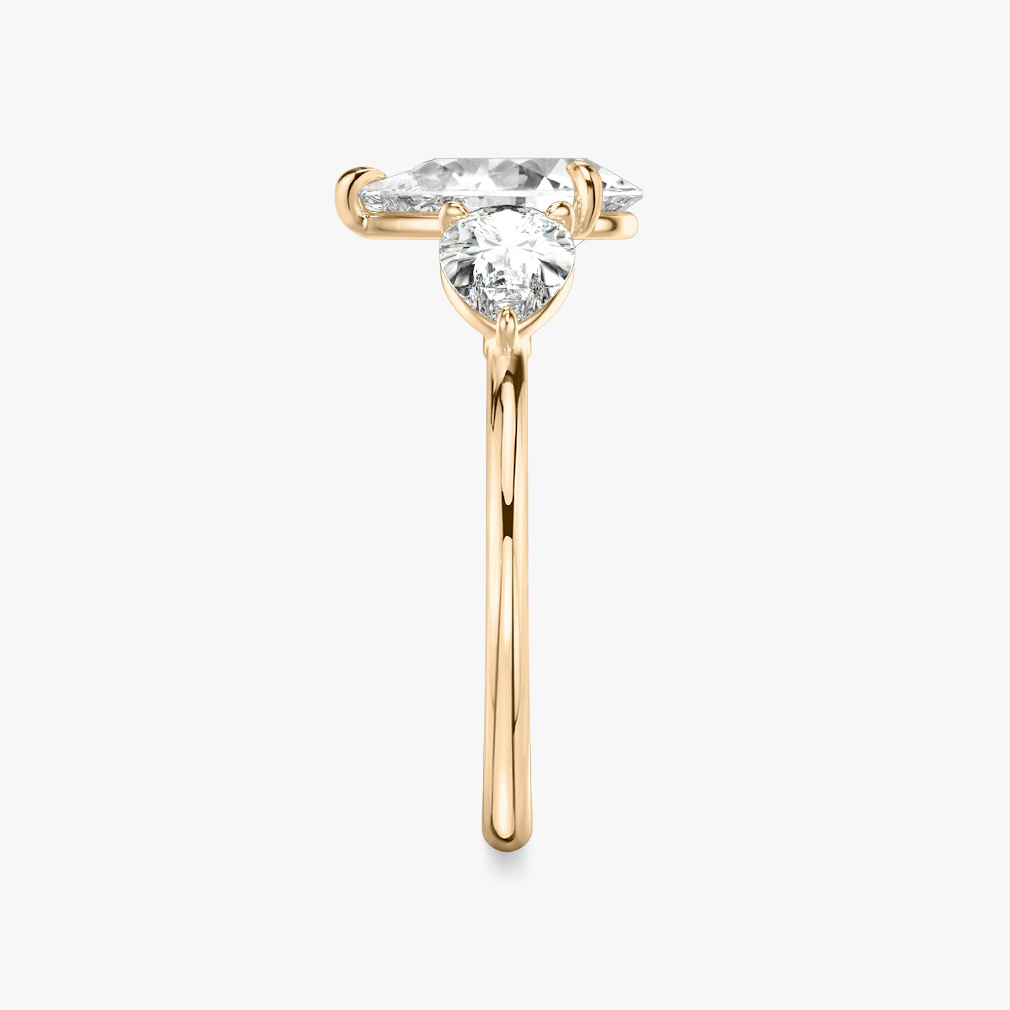 The Three Stone | Pear | 14k | Rose Gold | bandAccent: Plain | sideStoneCarat: 0.50ct | sideStoneShape: Pear | diamondOrientation: vertical | caratWeight: other