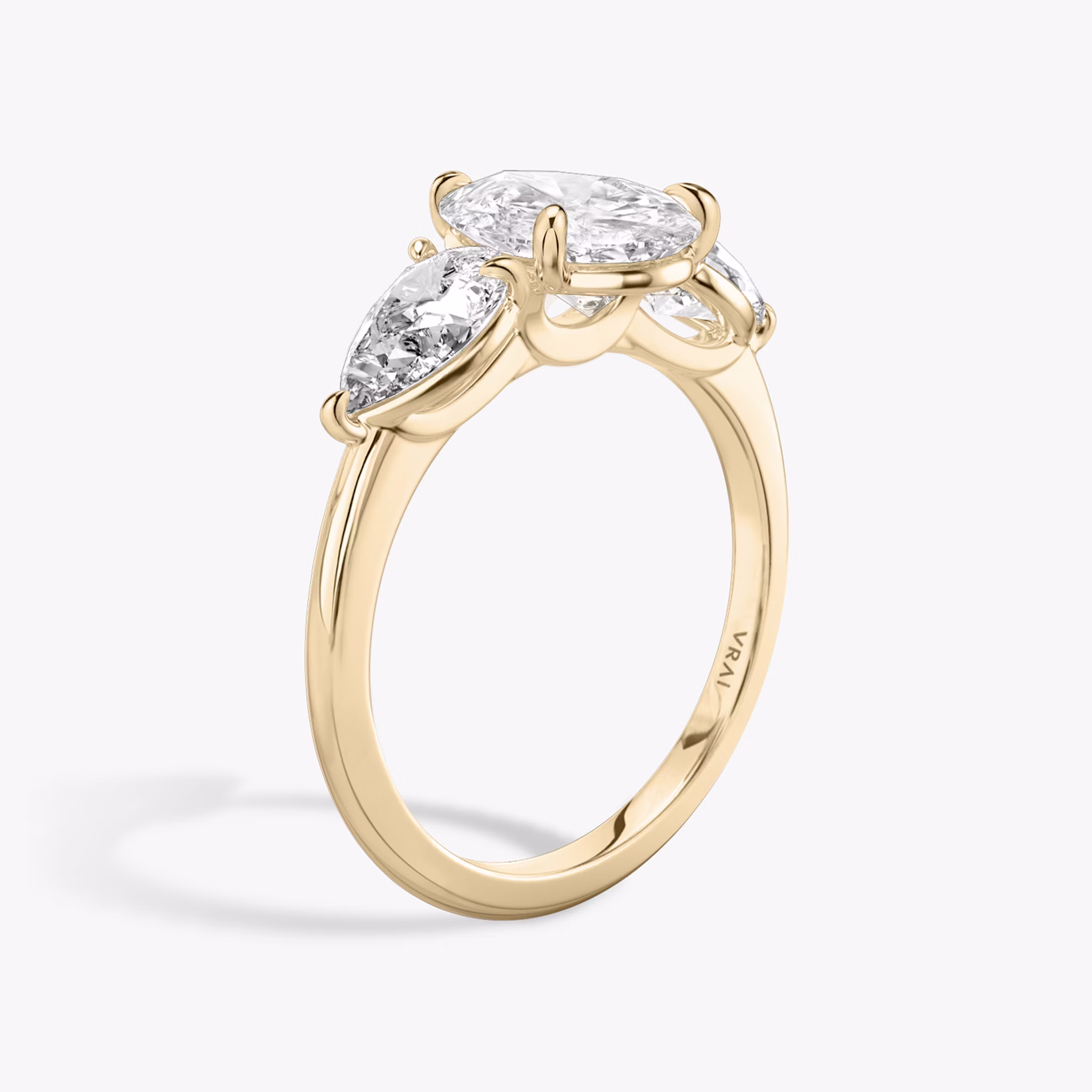 The Three Stone | Pear | 14k | Rose Gold | bandAccent: Plain | sideStoneCarat: 0.50ct | sideStoneShape: Pear | diamondOrientation: vertical | caratWeight: other