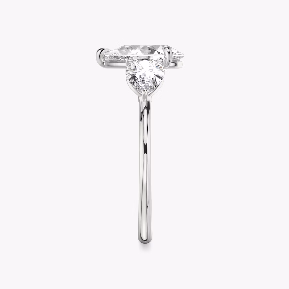 The Three Stone | Pear | Platinum | bandAccent: Plain | sideStoneCarat: 0.50ct | sideStoneShape: Pear | diamondOrientation: vertical | caratWeight: other