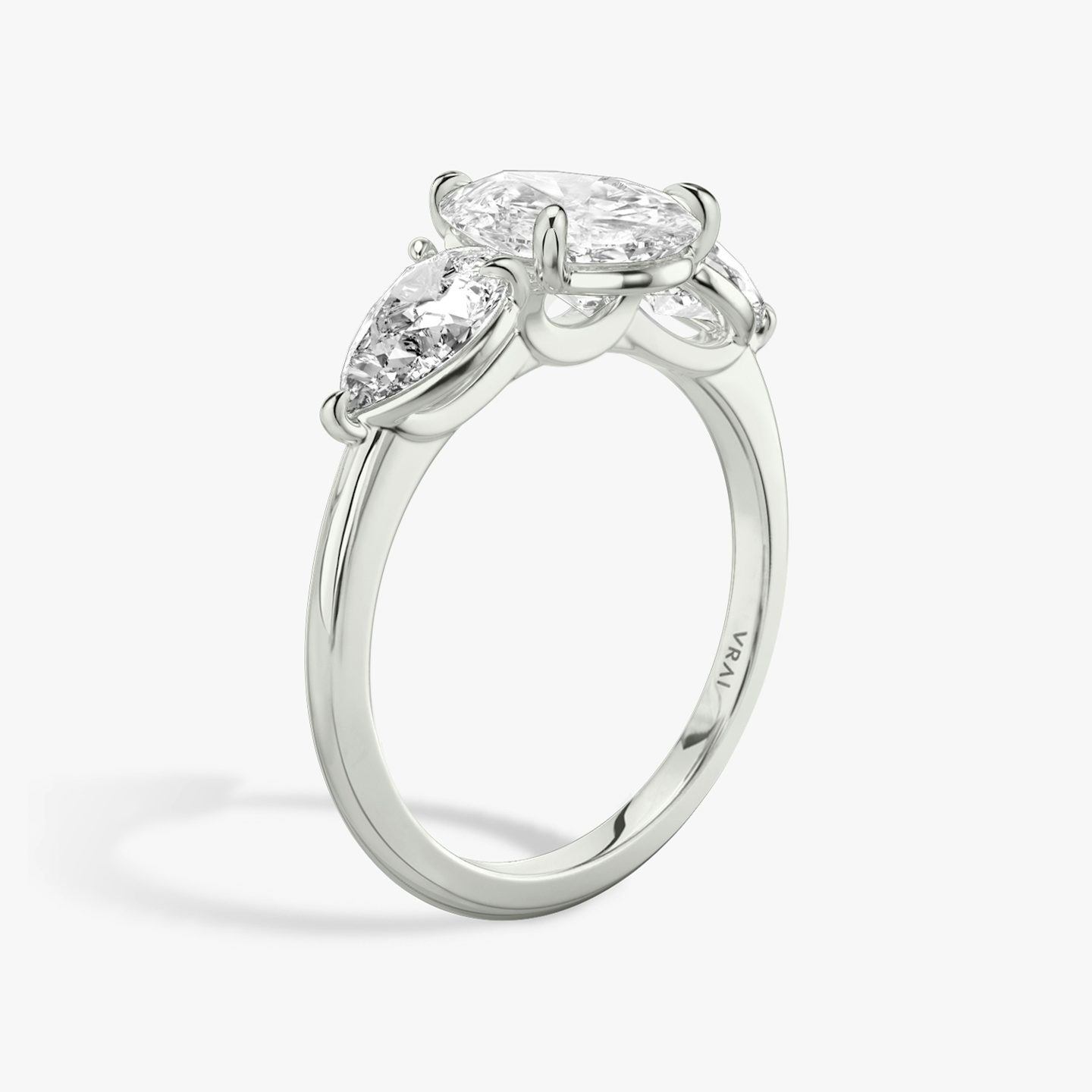 The Three Stone | Pear | Platinum | bandAccent: Plain | sideStoneCarat: 0.50ct | sideStoneShape: Pear | diamondOrientation: vertical | caratWeight: other