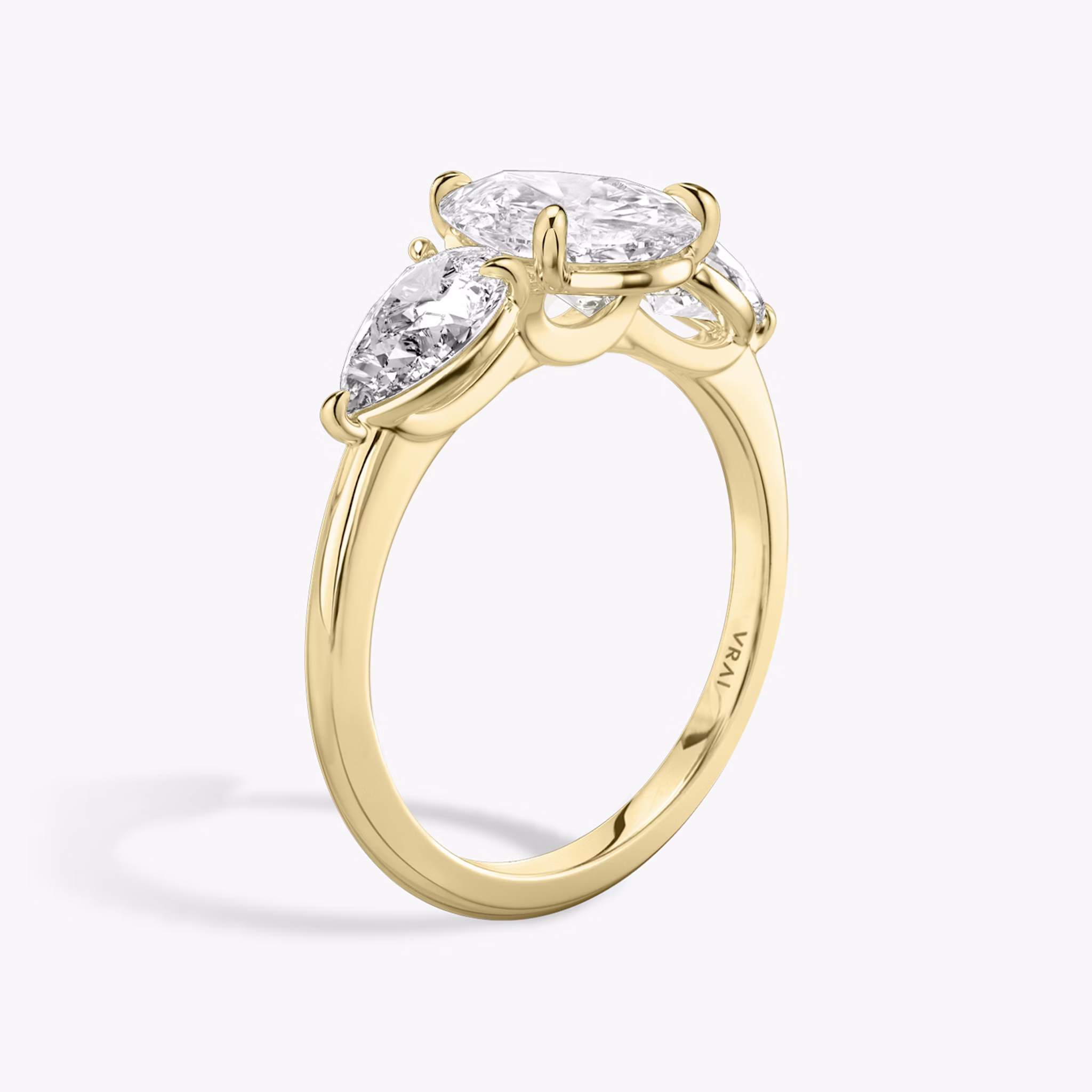 The Three Stone | Pear | 18k | Yellow Gold | bandAccent: Plain | sideStoneCarat: 0.50ct | sideStoneShape: Pear | diamondOrientation: vertical | caratWeight: other