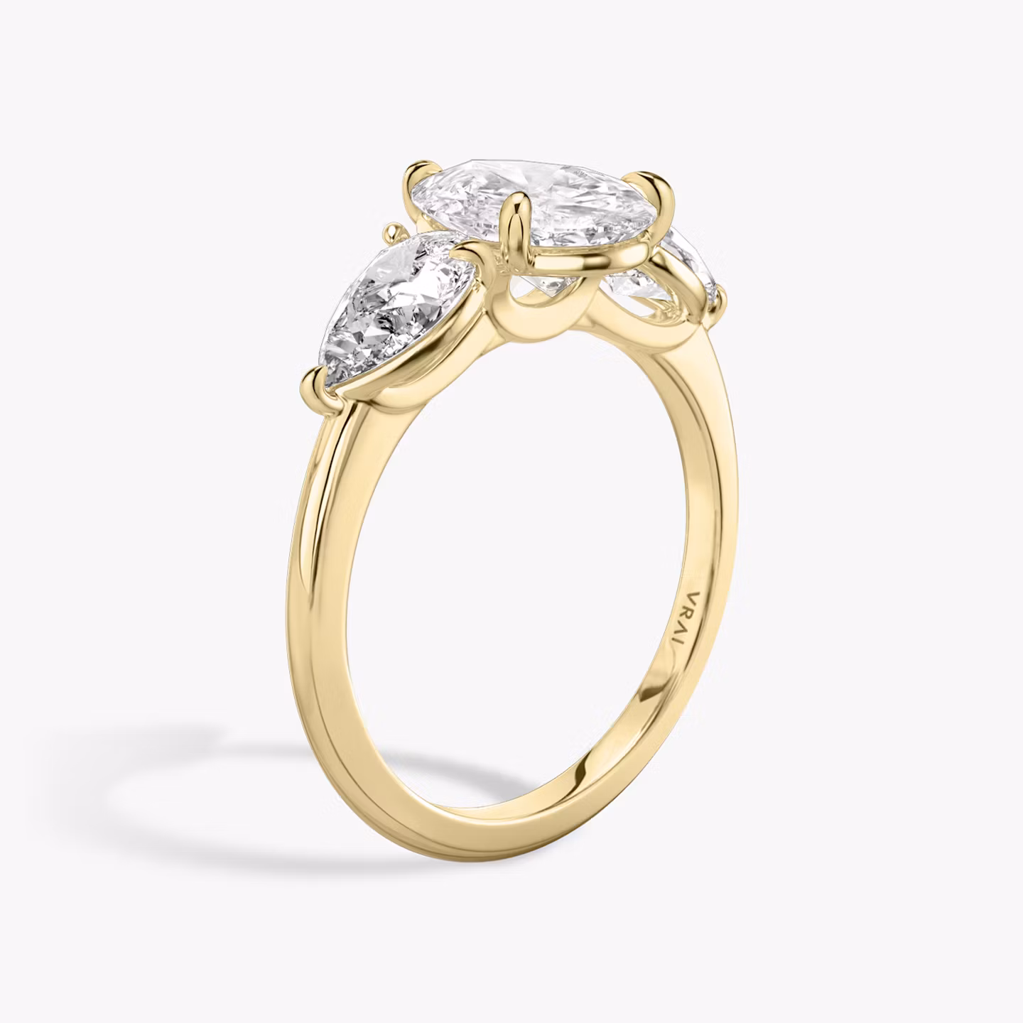 The Three Stone | Pear | 18k | Yellow Gold | bandAccent: Plain | sideStoneCarat: 0.50ct | sideStoneShape: Pear | diamondOrientation: vertical | caratWeight: other