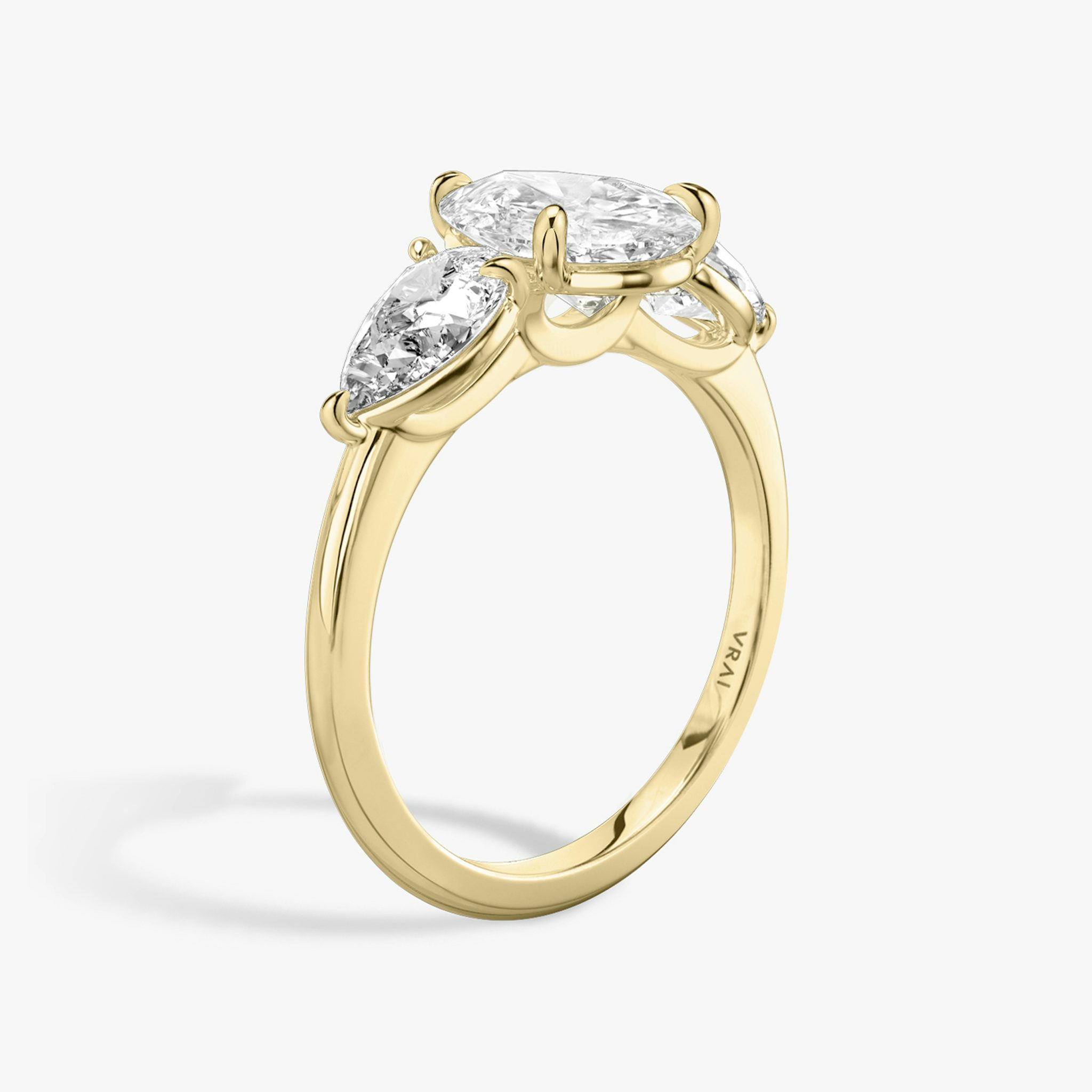 The Three Stone | Pear | 18k | Yellow Gold | bandAccent: Plain | sideStoneCarat: 0.50ct | sideStoneShape: Pear | diamondOrientation: vertical | caratWeight: other