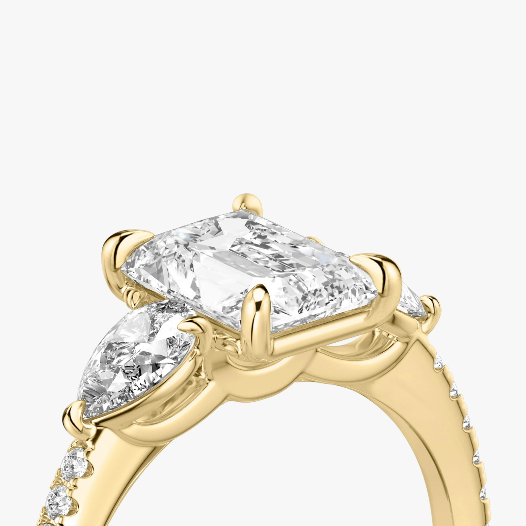 The Three Stone | Radiant | 18k | Yellow Gold | bandAccent: Pavé | sideStoneCarat: 0.25ct | sideStoneShape: Pear | diamondOrientation: vertical | caratWeight: other