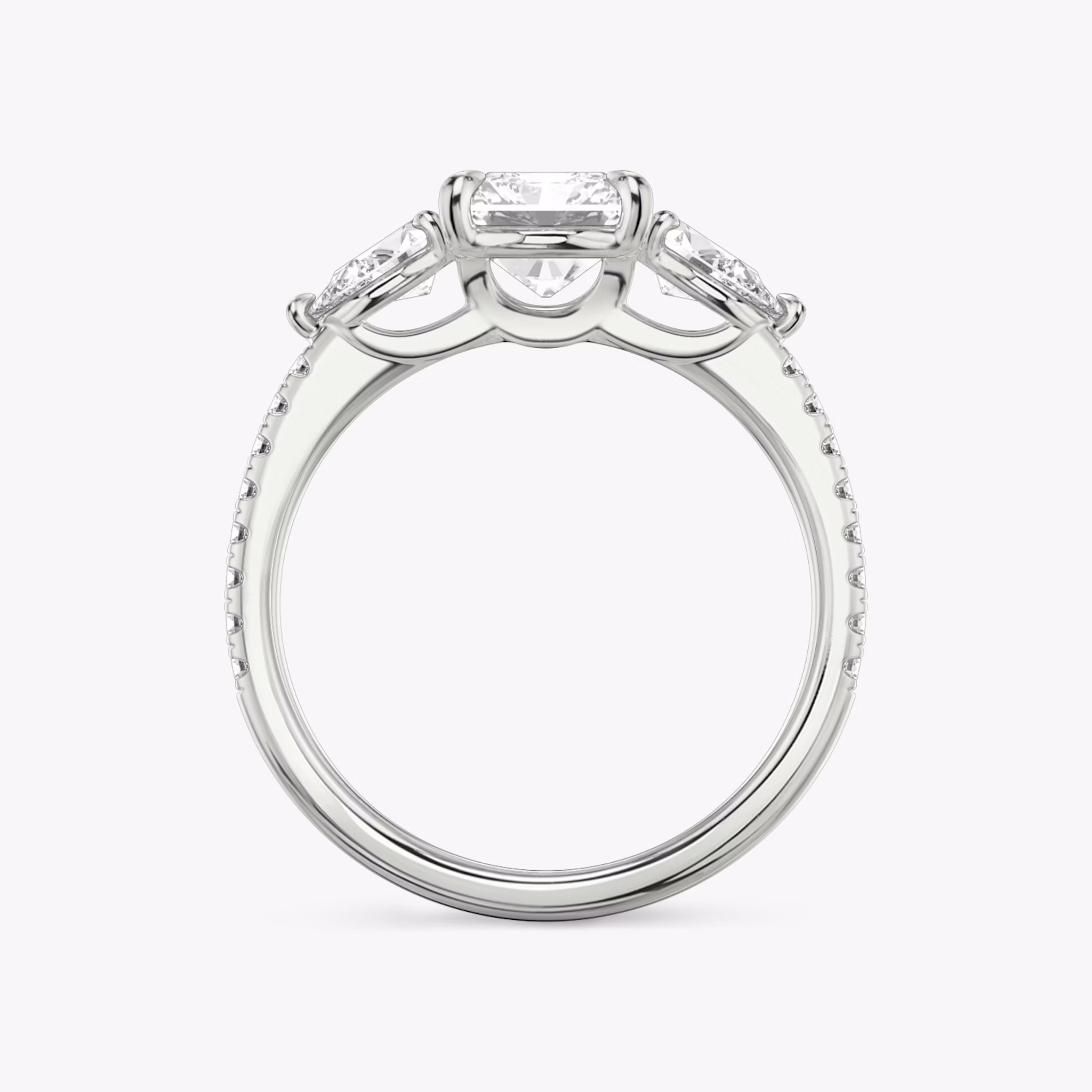 The Three Stone | Radiant | Platinum | bandAccent: Pavé | sideStoneCarat: 0.25ct | sideStoneShape: Pear | diamondOrientation: vertical | caratWeight: other