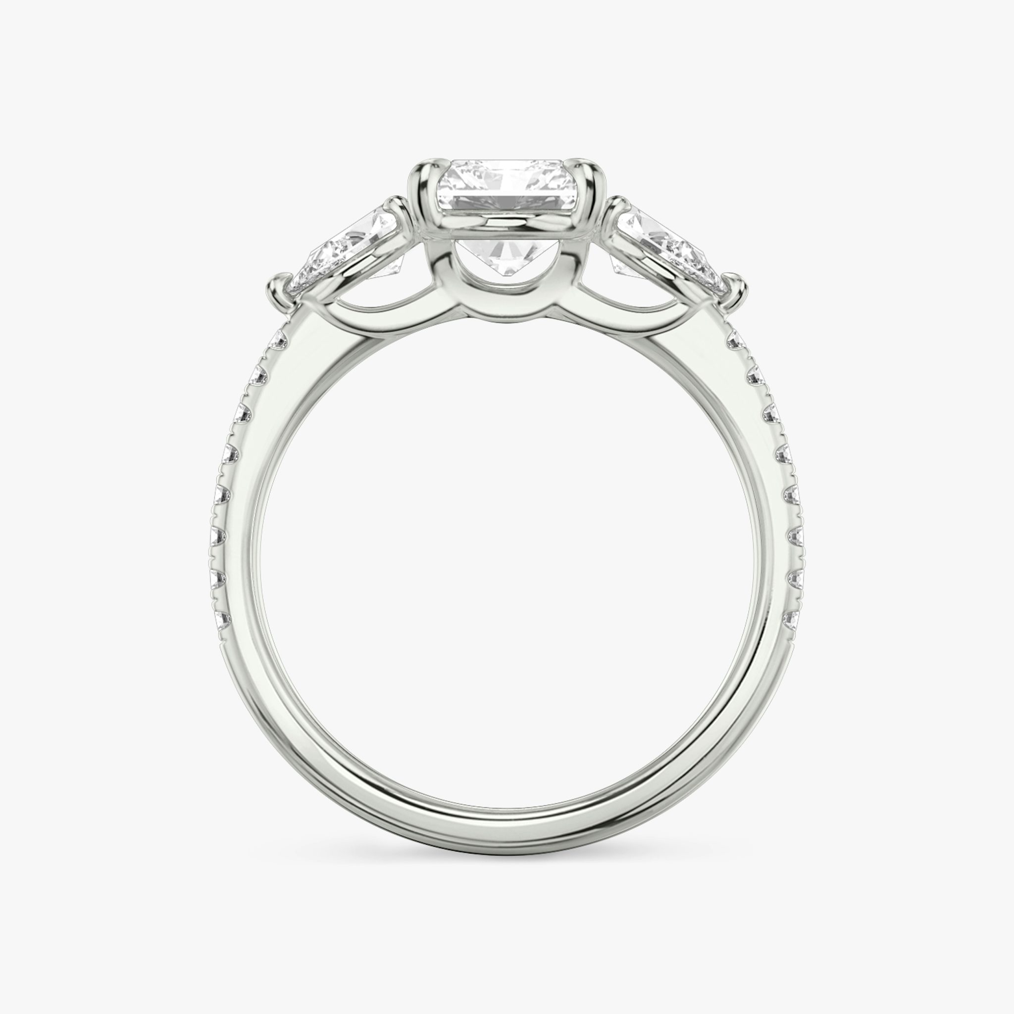 The Three Stone | Radiant | Platinum | bandAccent: Pavé | sideStoneCarat: 0.25ct | sideStoneShape: Pear | diamondOrientation: vertical | caratWeight: other