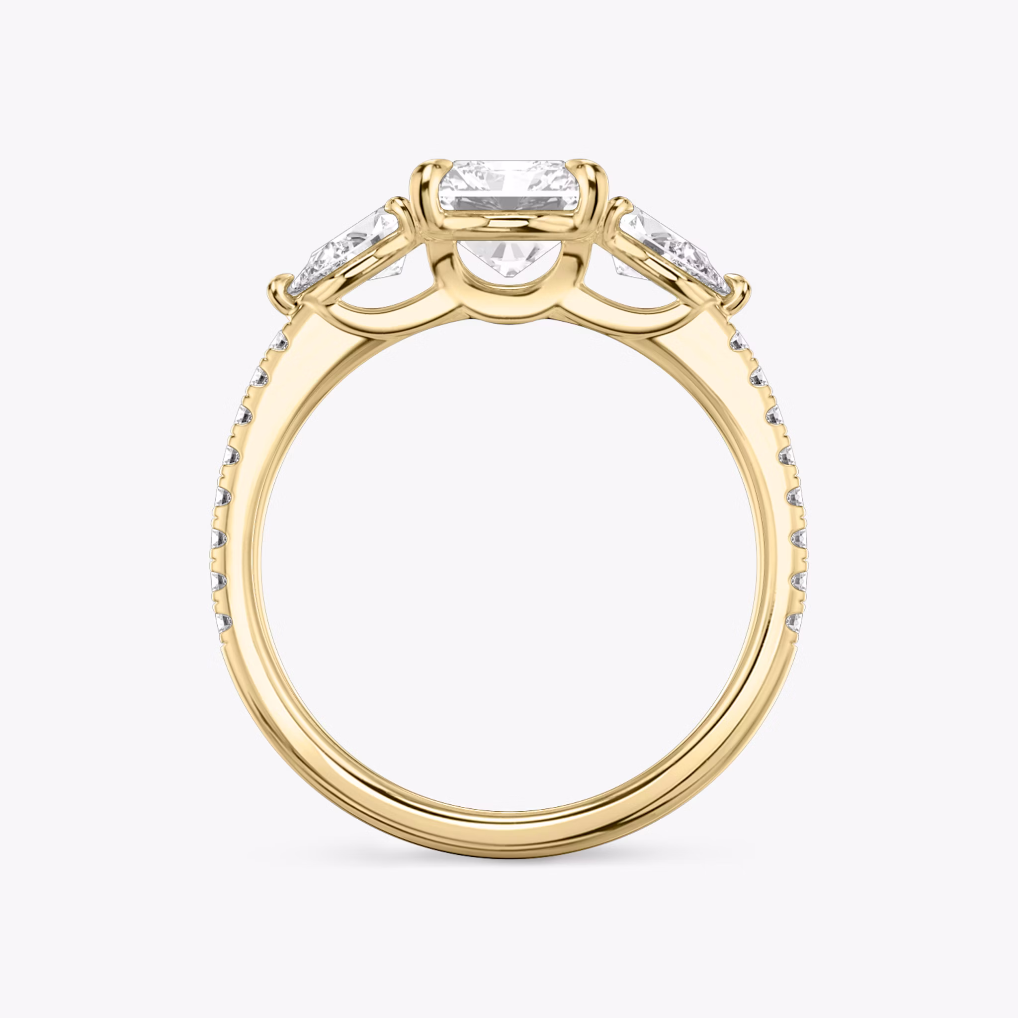 The Three Stone | Radiant | 18k | Yellow Gold | bandAccent: Pavé | sideStoneCarat: 0.25ct | sideStoneShape: Pear | diamondOrientation: vertical | caratWeight: other