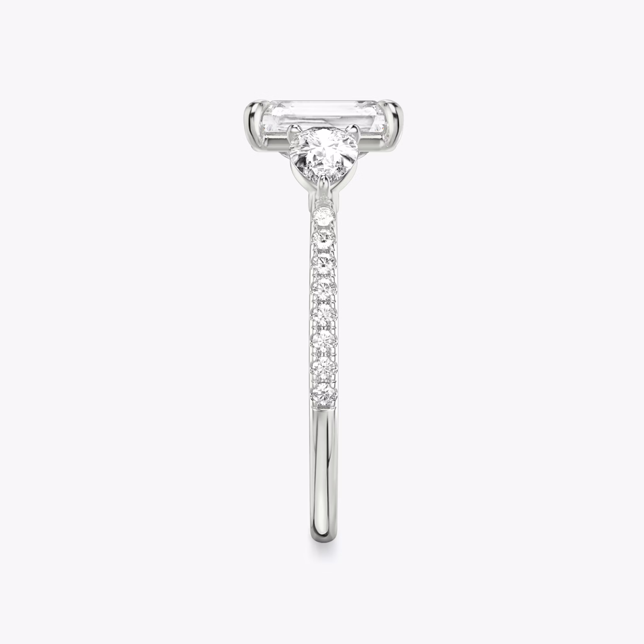 The Three Stone | Radiant | Platinum | bandAccent: Pavé | sideStoneCarat: 0.25ct | sideStoneShape: Pear | diamondOrientation: vertical | caratWeight: other