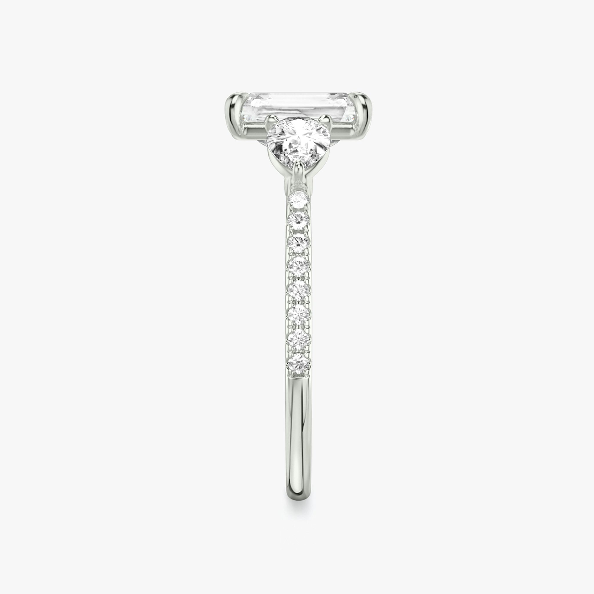 The Three Stone | Radiant | Platinum | bandAccent: Pavé | sideStoneCarat: 0.25ct | sideStoneShape: Pear | diamondOrientation: vertical | caratWeight: other