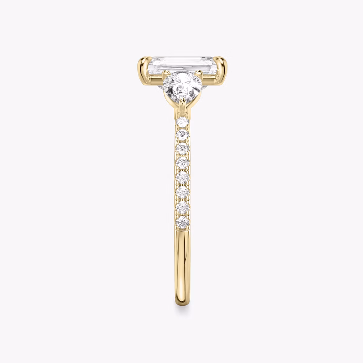 The Three Stone | Radiant | 18k | Yellow Gold | bandAccent: Pavé | sideStoneCarat: 0.25ct | sideStoneShape: Pear | diamondOrientation: vertical | caratWeight: other