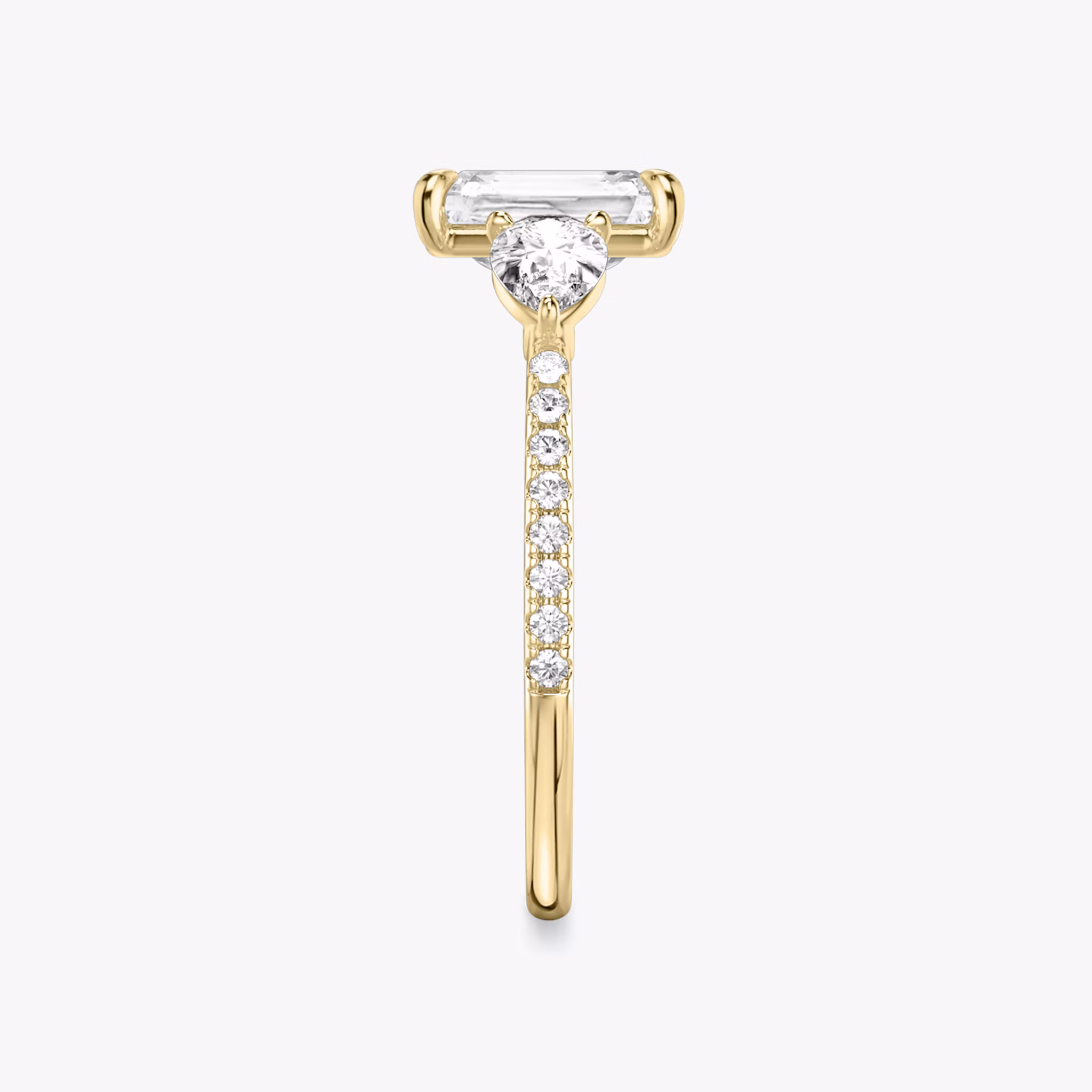 The Three Stone | Radiant | 18k | Yellow Gold | bandAccent: Pavé | sideStoneCarat: 0.25ct | sideStoneShape: Pear | diamondOrientation: vertical | caratWeight: other