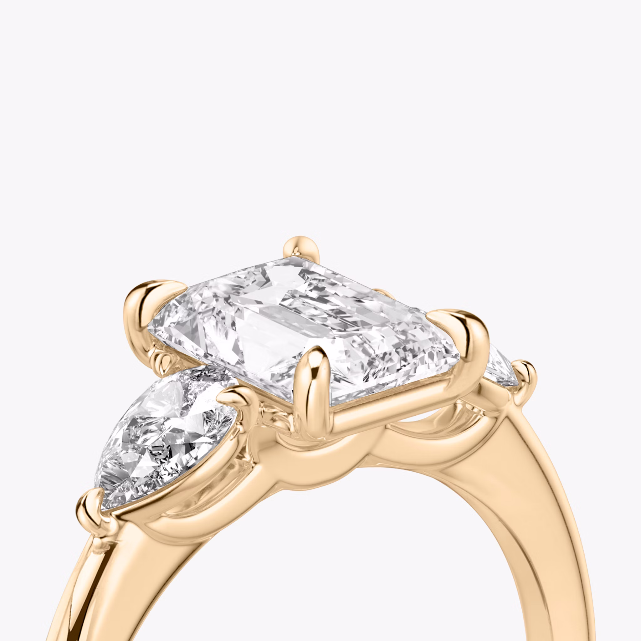 The Three Stone | Radiant | 14k | Rose Gold | bandAccent: Plain | sideStoneCarat: 0.25ct | sideStoneShape: Pear | diamondOrientation: vertical | caratWeight: other