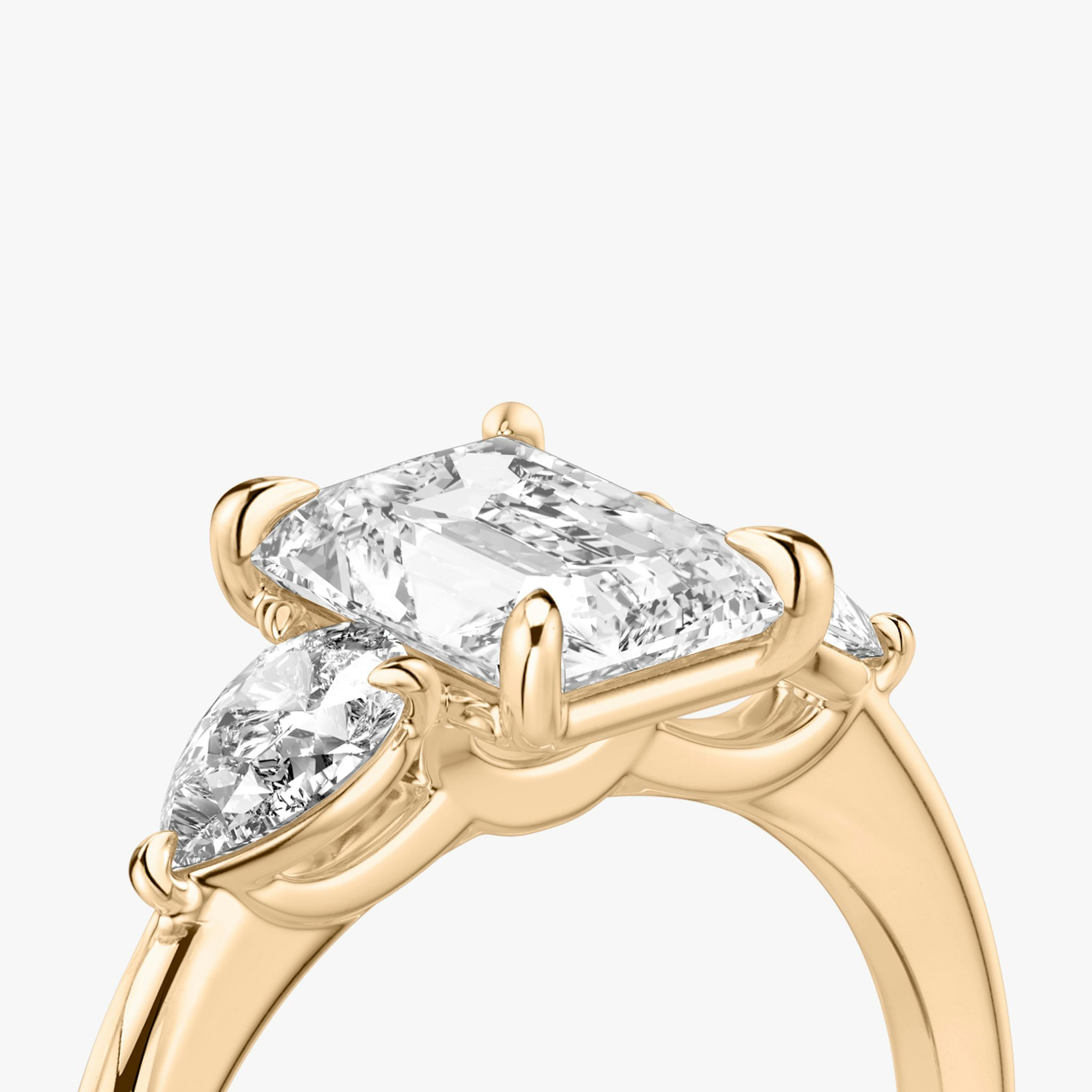 The Three Stone | Radiant | 14k | Rose Gold | bandAccent: Plain | sideStoneCarat: 0.25ct | sideStoneShape: Pear | diamondOrientation: vertical | caratWeight: other