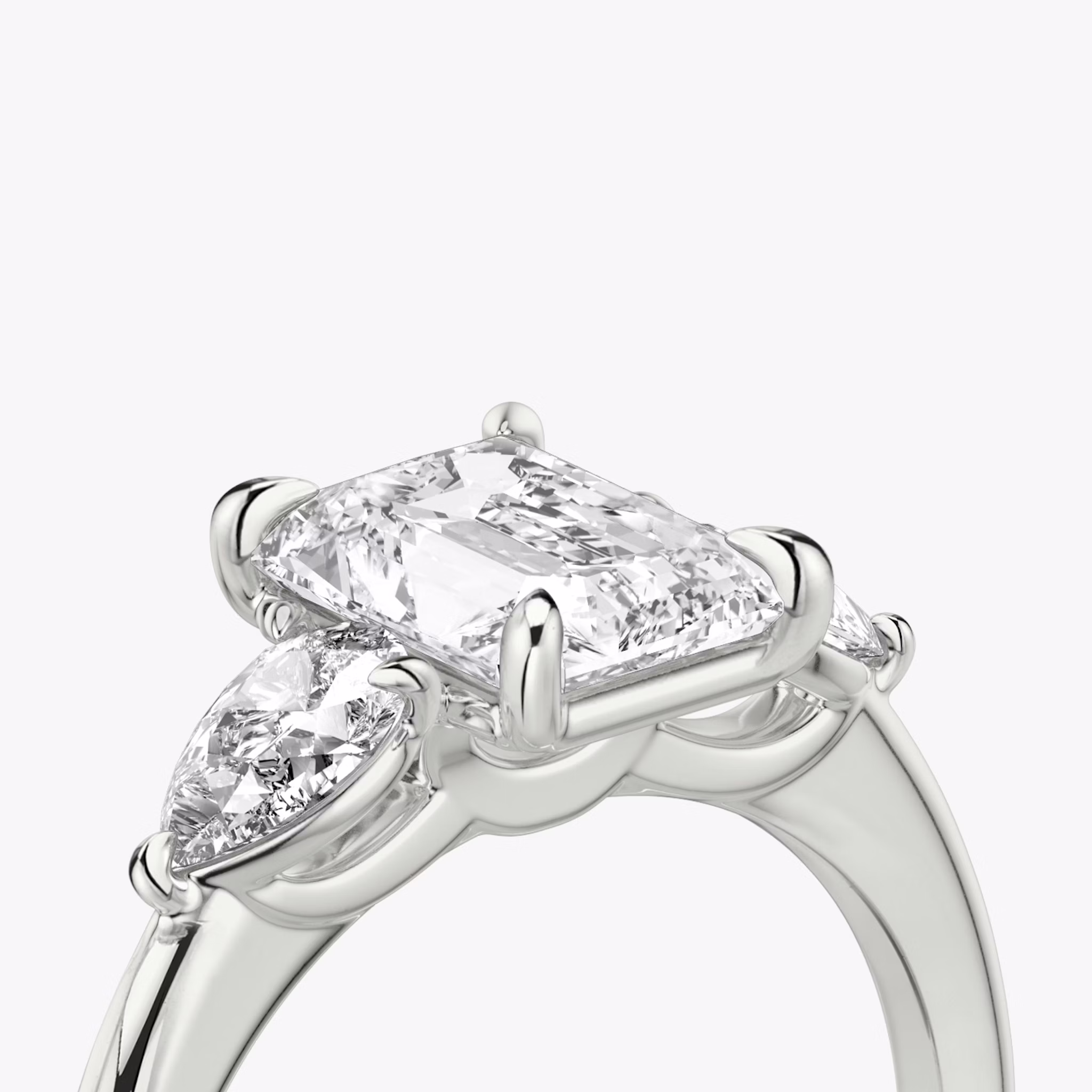 The Three Stone | Radiant | 18k | White Gold | bandAccent: Plain | sideStoneCarat: 0.25ct | sideStoneShape: Pear | diamondOrientation: vertical | caratWeight: other