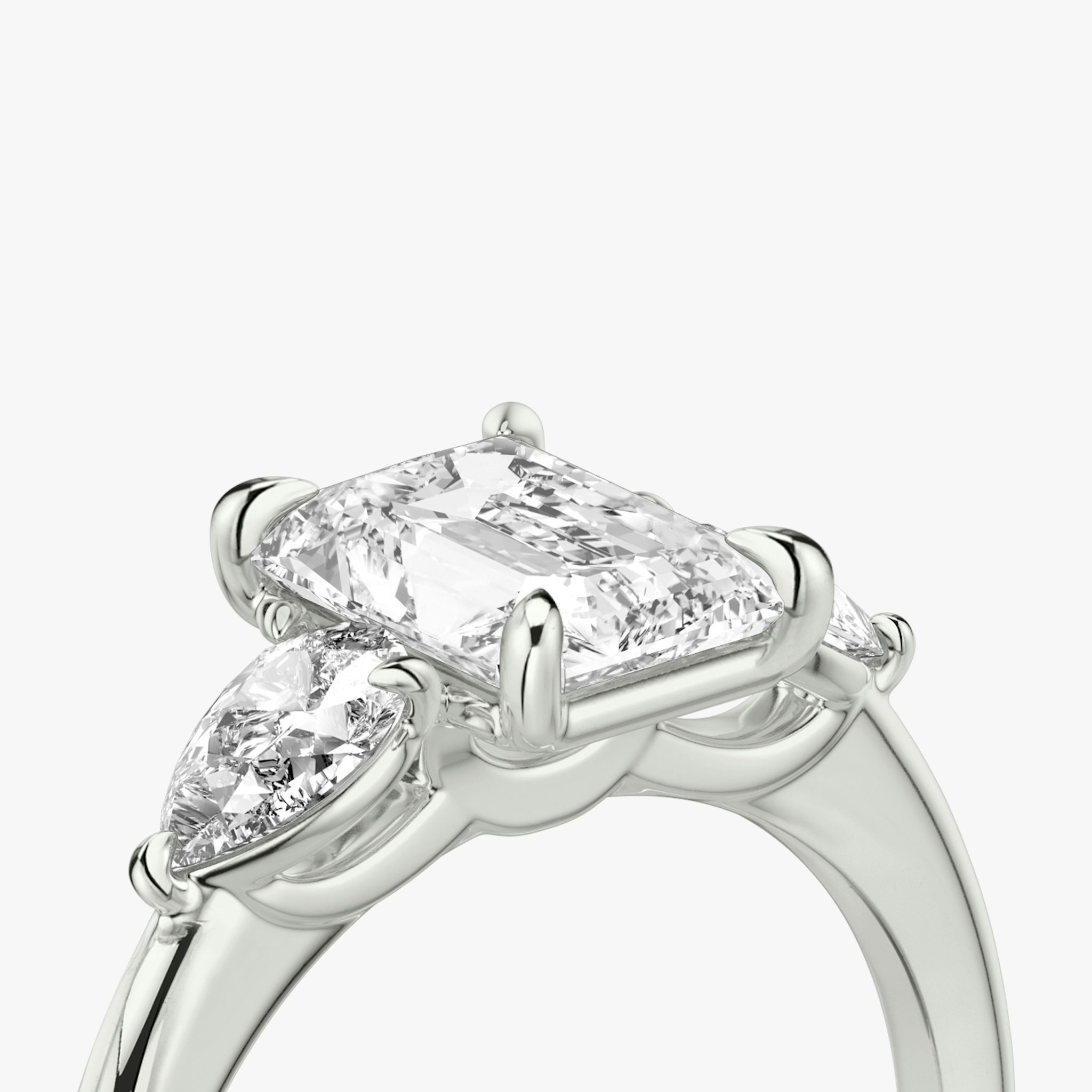 The Three Stone | Radiant | 18k | White Gold | bandAccent: Plain | sideStoneCarat: 0.25ct | sideStoneShape: Pear | diamondOrientation: vertical | caratWeight: other