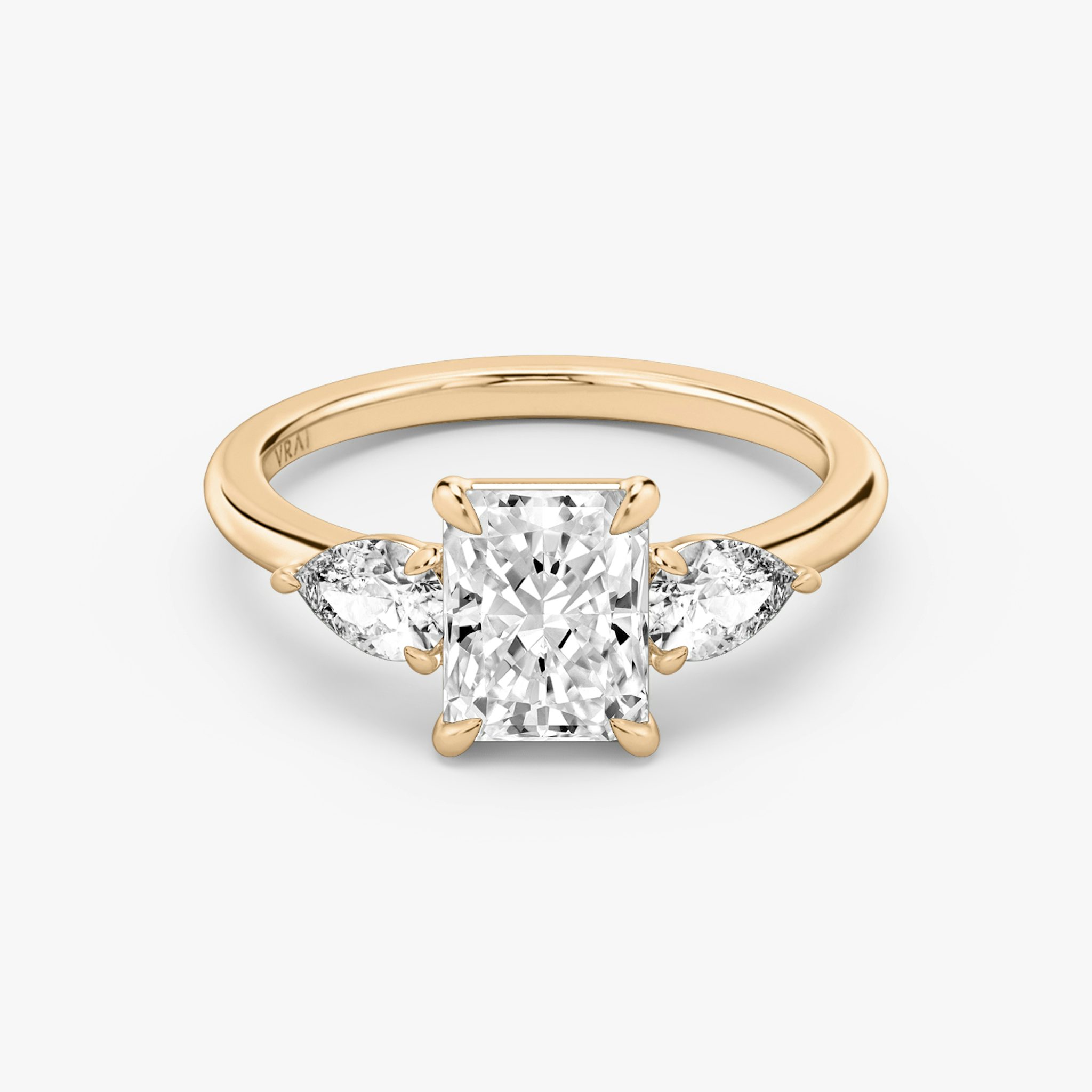 The Three Stone | Radiant | 14k | Rose Gold | bandAccent: Plain | sideStoneCarat: 0.25ct | sideStoneShape: Pear | diamondOrientation: vertical | caratWeight: other