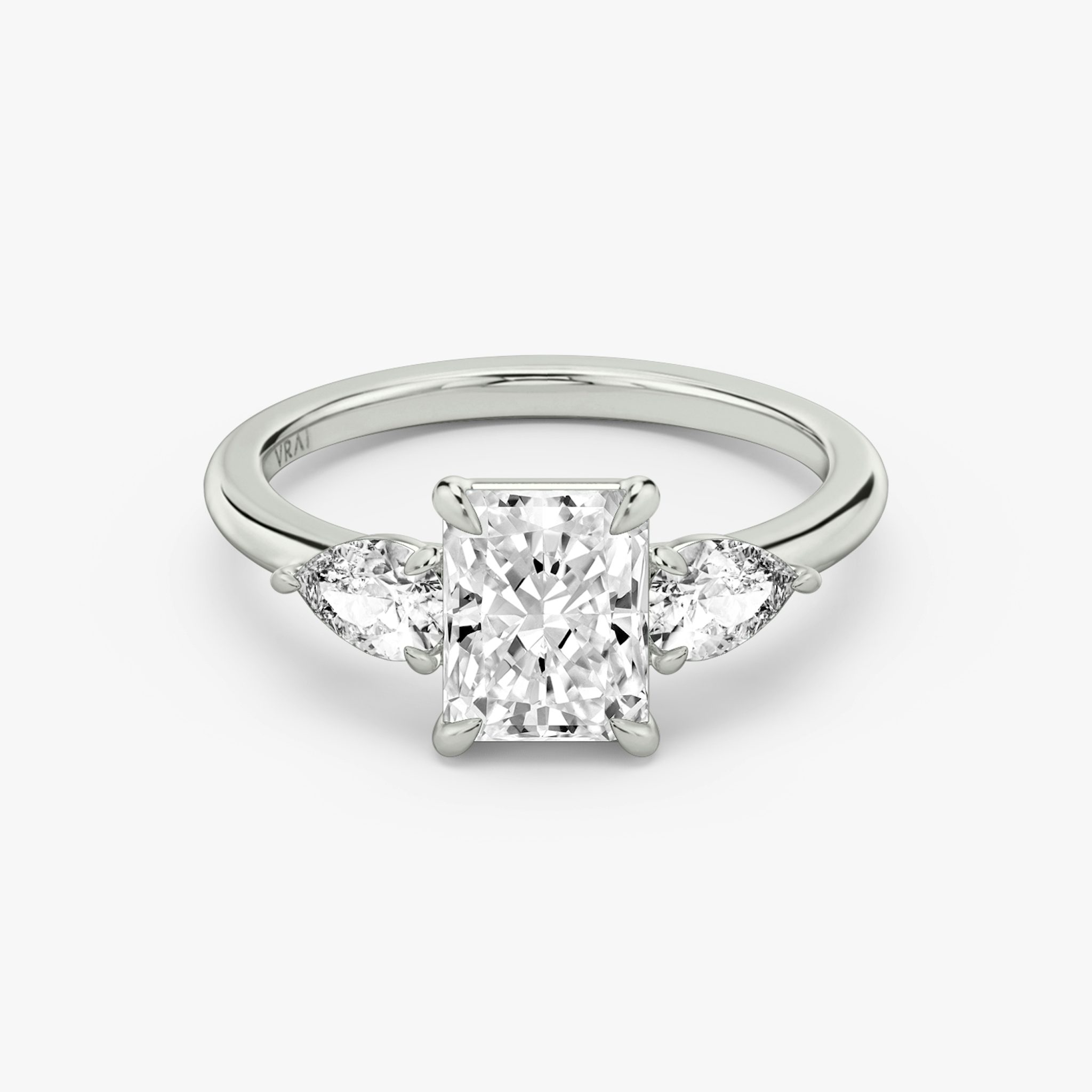 The Three Stone | Radiant | 18k | White Gold | bandAccent: Plain | sideStoneCarat: 0.25ct | sideStoneShape: Pear | diamondOrientation: vertical | caratWeight: other