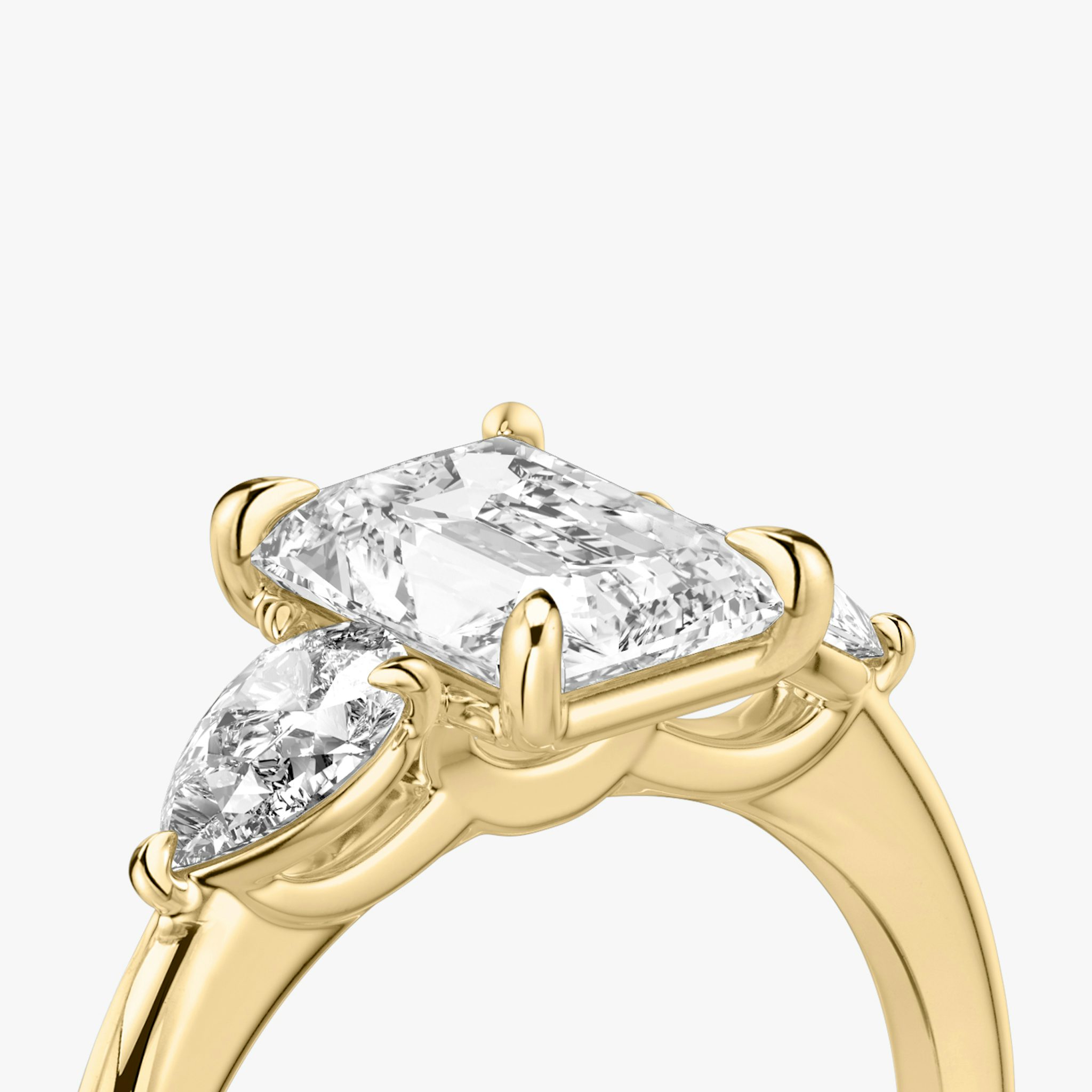 The Three Stone | Radiant | 18k | Yellow Gold | bandAccent: Plain | sideStoneCarat: 0.25ct | sideStoneShape: Pear | diamondOrientation: vertical | caratWeight: other